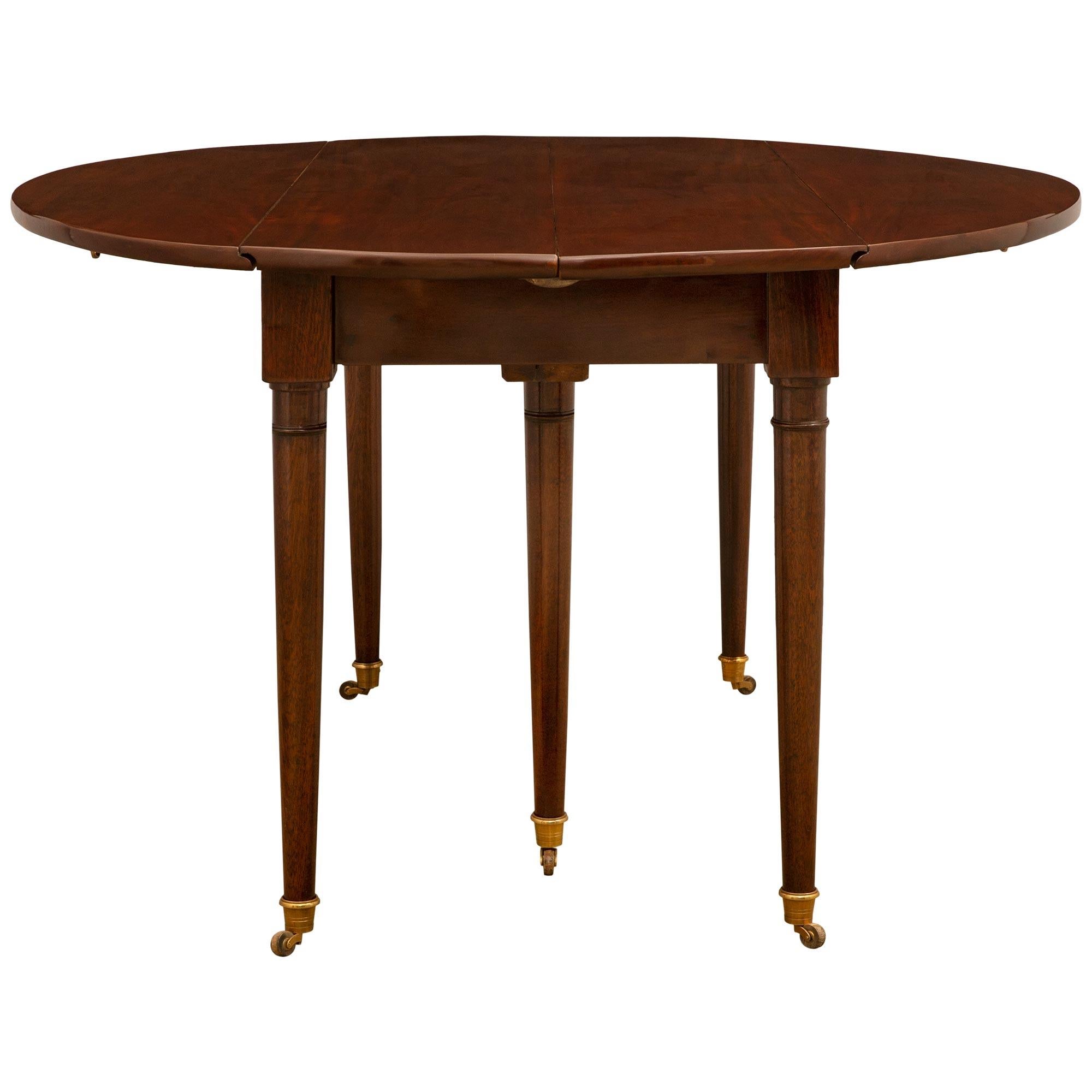 Early 19th Century French Louis XVI Style Mahogany Drop-Leaf Dining Table In Good Condition For Sale In West Palm Beach, FL