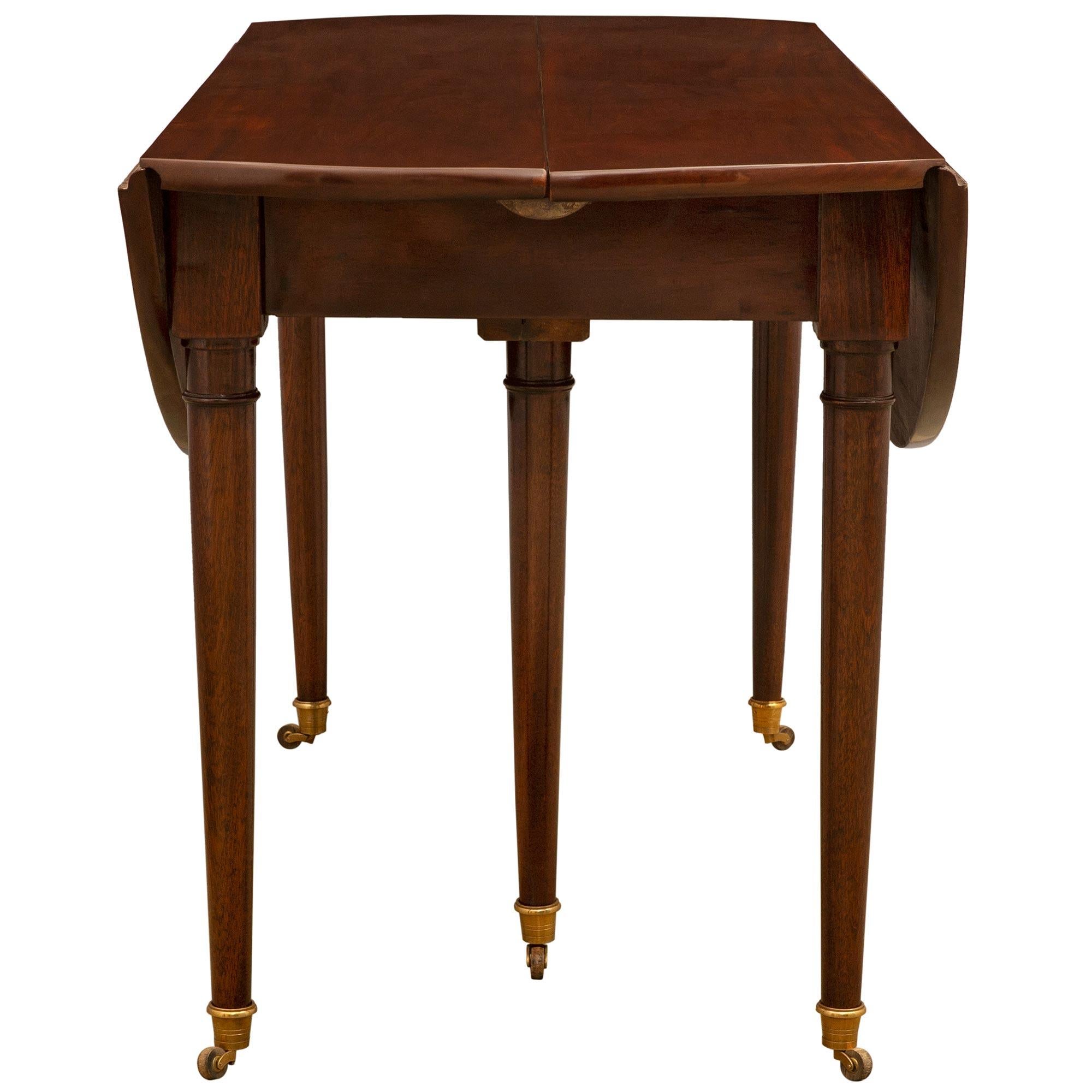 Early 19th Century French Louis XVI Style Mahogany Drop-Leaf Dining Table For Sale 1