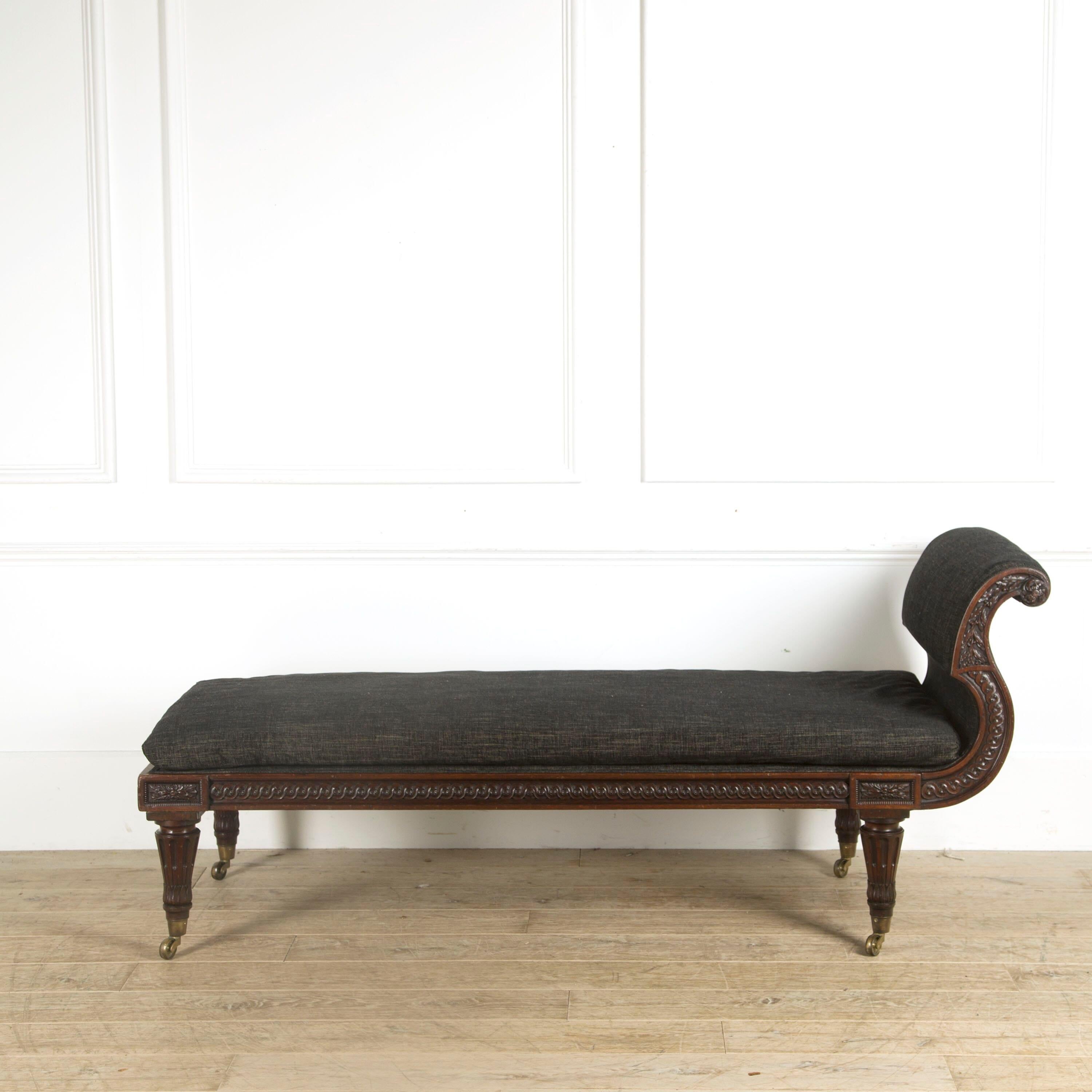 A handsome and finely carved French mahogany daybed, stamped JACOB. Paris circa, 1810.