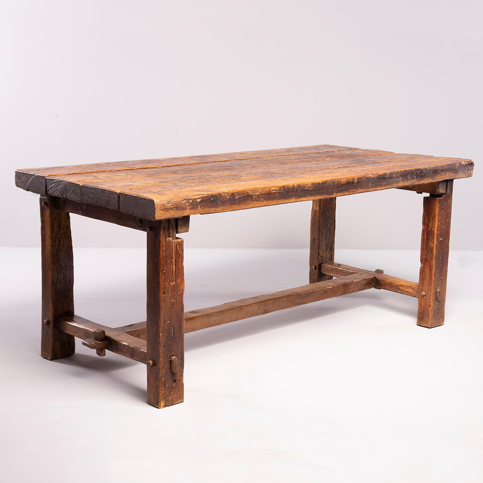 Early 19th century rustic oak table with mortise and tenon construction found in France. Four plank top. Great patina and wear.