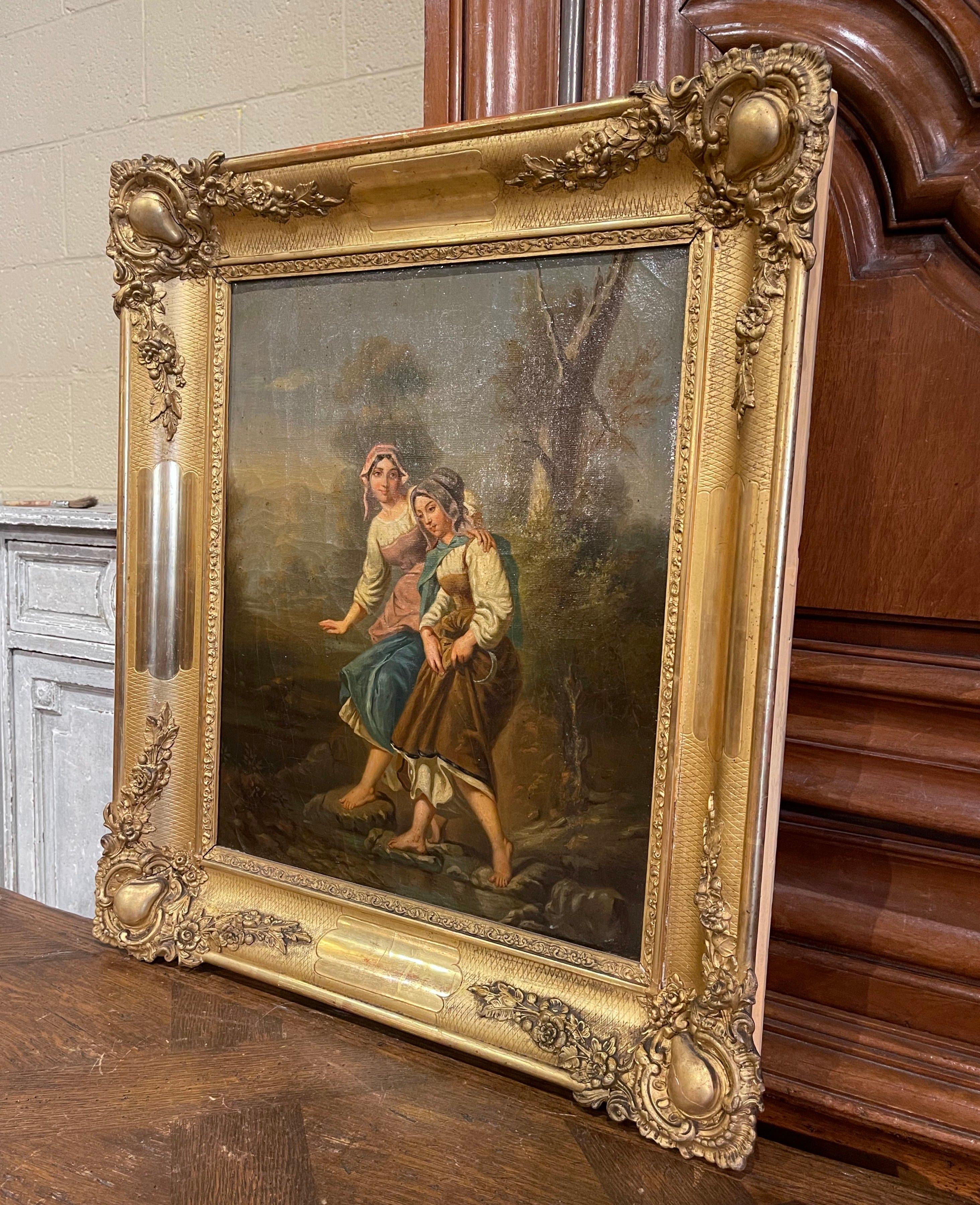 This elegant antique painting was created in France circa 1830. Set in the original carved gilt wood frame, the hand painted canvas depicts two young beauties strolling bare foot on rocky ground with pastoral surroundings; wonderful facial