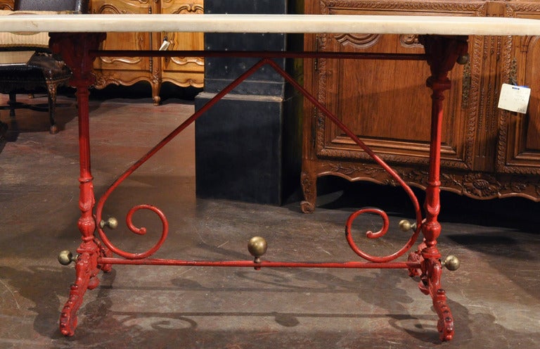 Incorporate extra surface space into your kitchen area with this elegant antique iron butcher table (or pastry table). Crafted in France, circa 1820, the traditional work table sits on two pedestal legs supported with a forged scrolling stretcher,