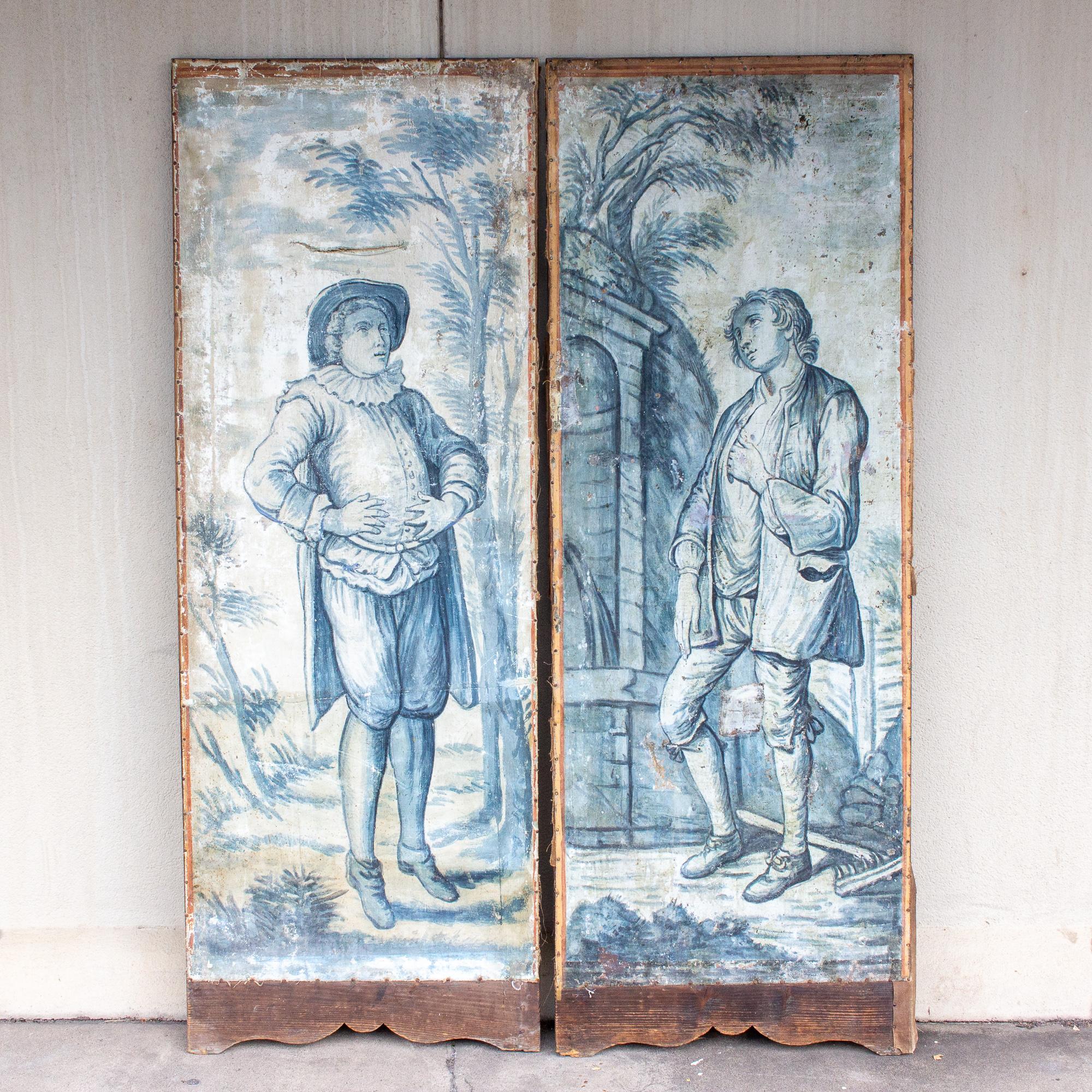 These charming panels were likely once a screen-style room divider and have been crafted with wood and hand painted canvas. The subject is two men in a landscape that is accented with plant-life and some architectural details. Based on the clothing