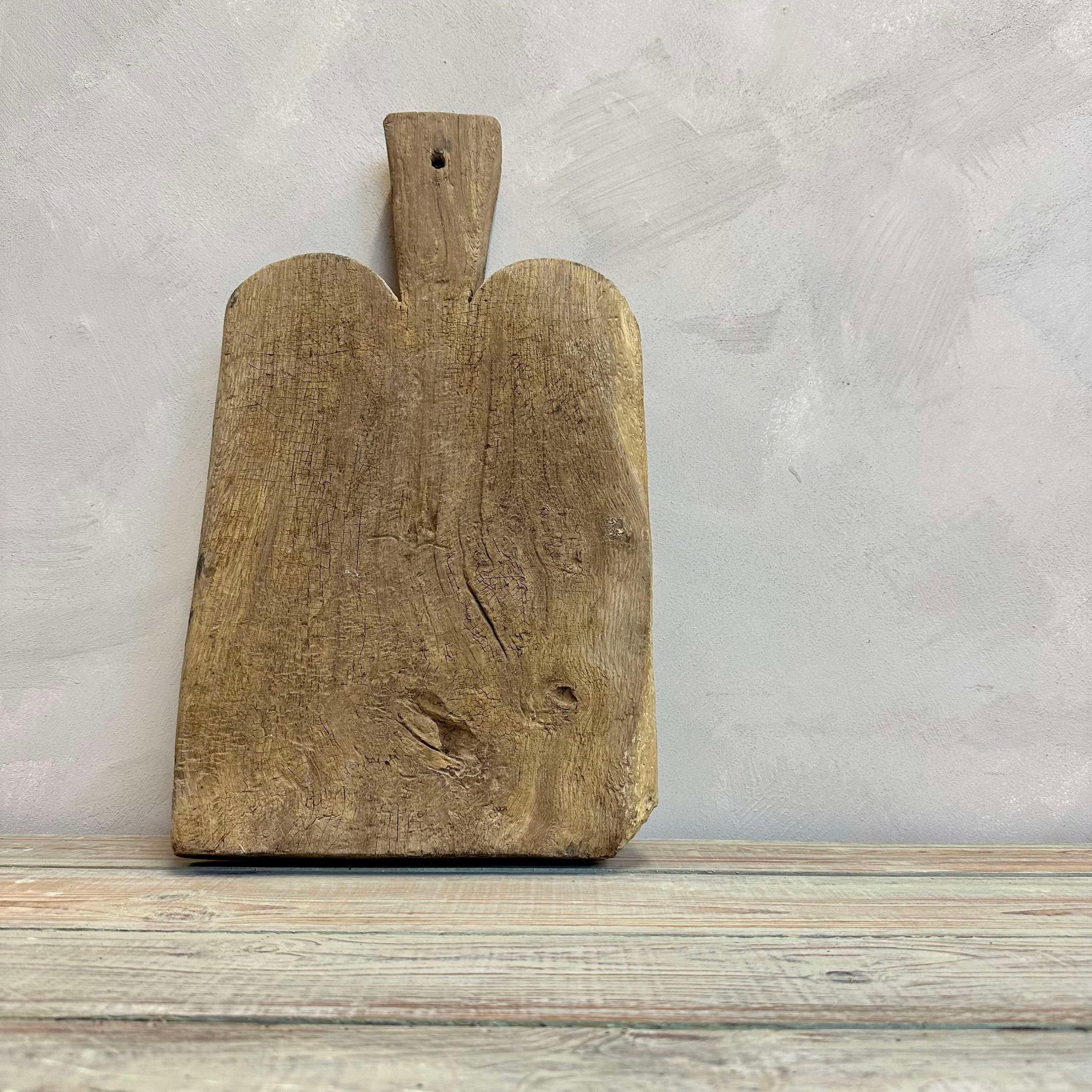 Early 19th Century French primitive cutting board.
From use this has a lovely gnarled texture.

Height -49cm
Width -27cm
Depth -5cm

Please message if any further info or photos are required 

We are happy to work with you with your choice of