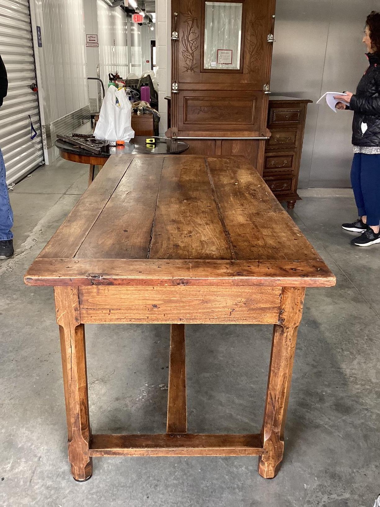 If you love true rustic furniture, this is the table for you. Made in the late 1800's in Brittany, France, this table was originally used as a work table in a kitchen. It also served as a table for dining with long benches on either side. The top is