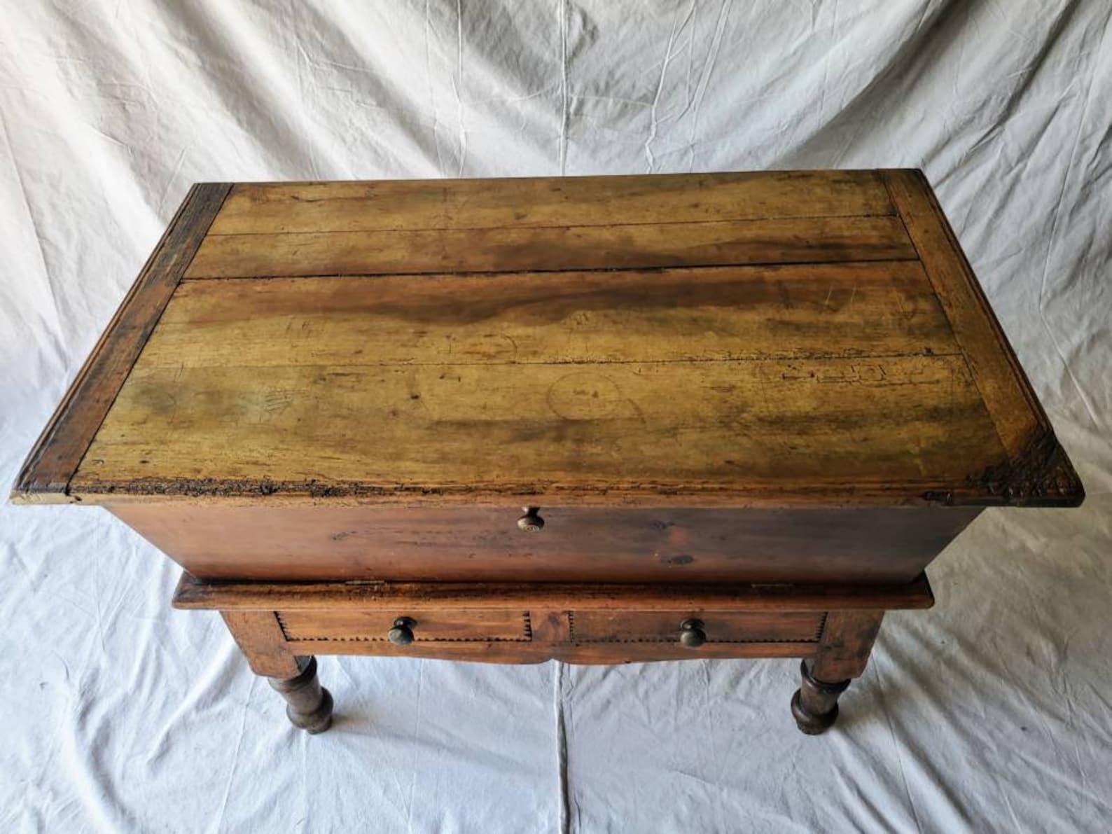 Patina perfection! A rustic French Provincial baker's dough bin trough on stand form the early 19th century. The Restoration / Louis Philippe period antique having a drop-front panel on later updated hinges, opening to a spacious open interior,