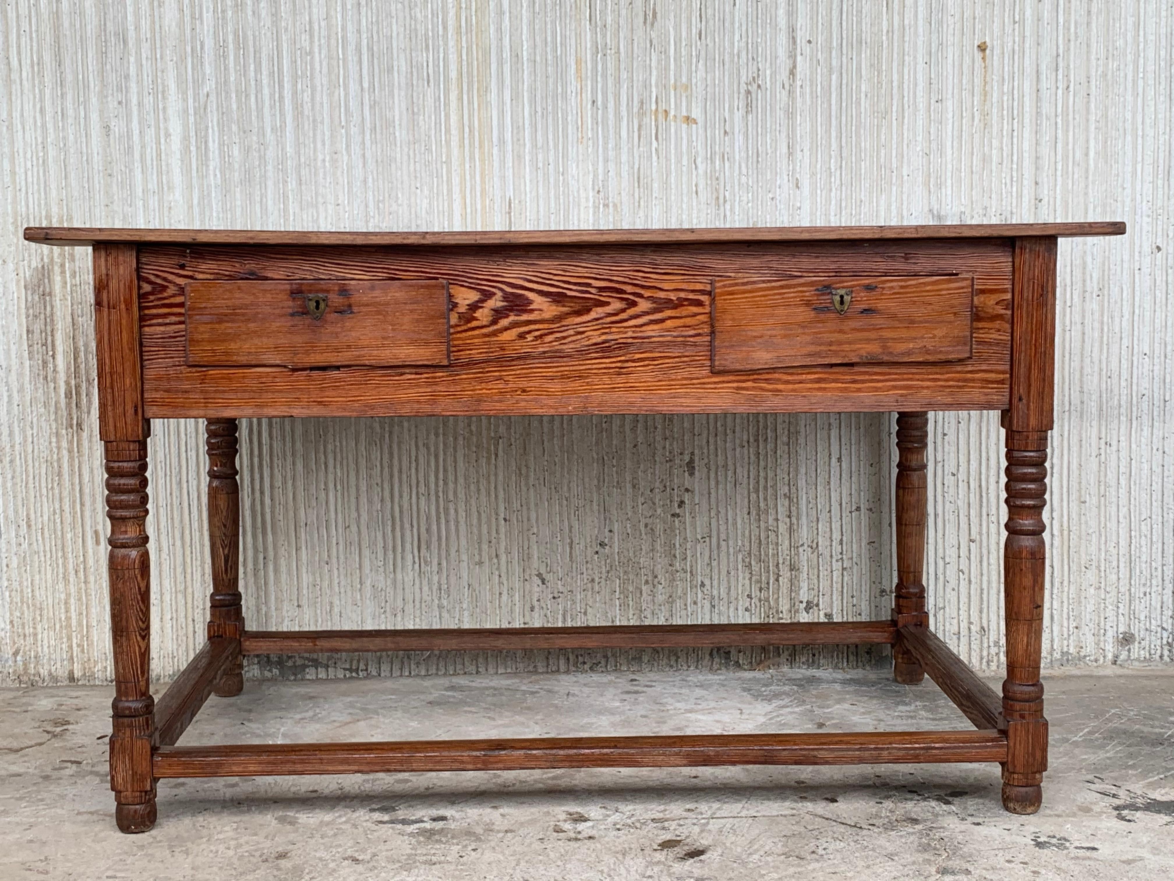 Oak refectory table. The thick 3 plank top on a simple base with no less then 11 drawers, some of then cutout to fit wooden dishes. The whole piece has a beautiful patina and attractive proportions.
Tables like these most likely stood in castle