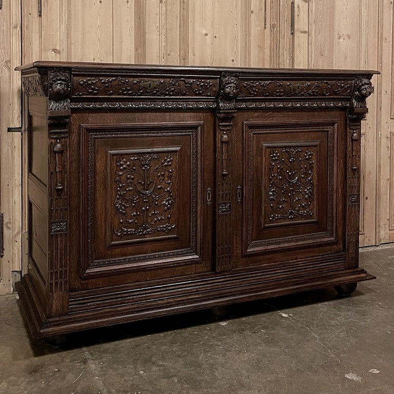 Early 19th century French Renaissance Buffet is a splendid example of fine cabinetry using techniques and tools that date back centuries ago! The entire facade is a work of art, but examining it section by section is required to fully appreciate the