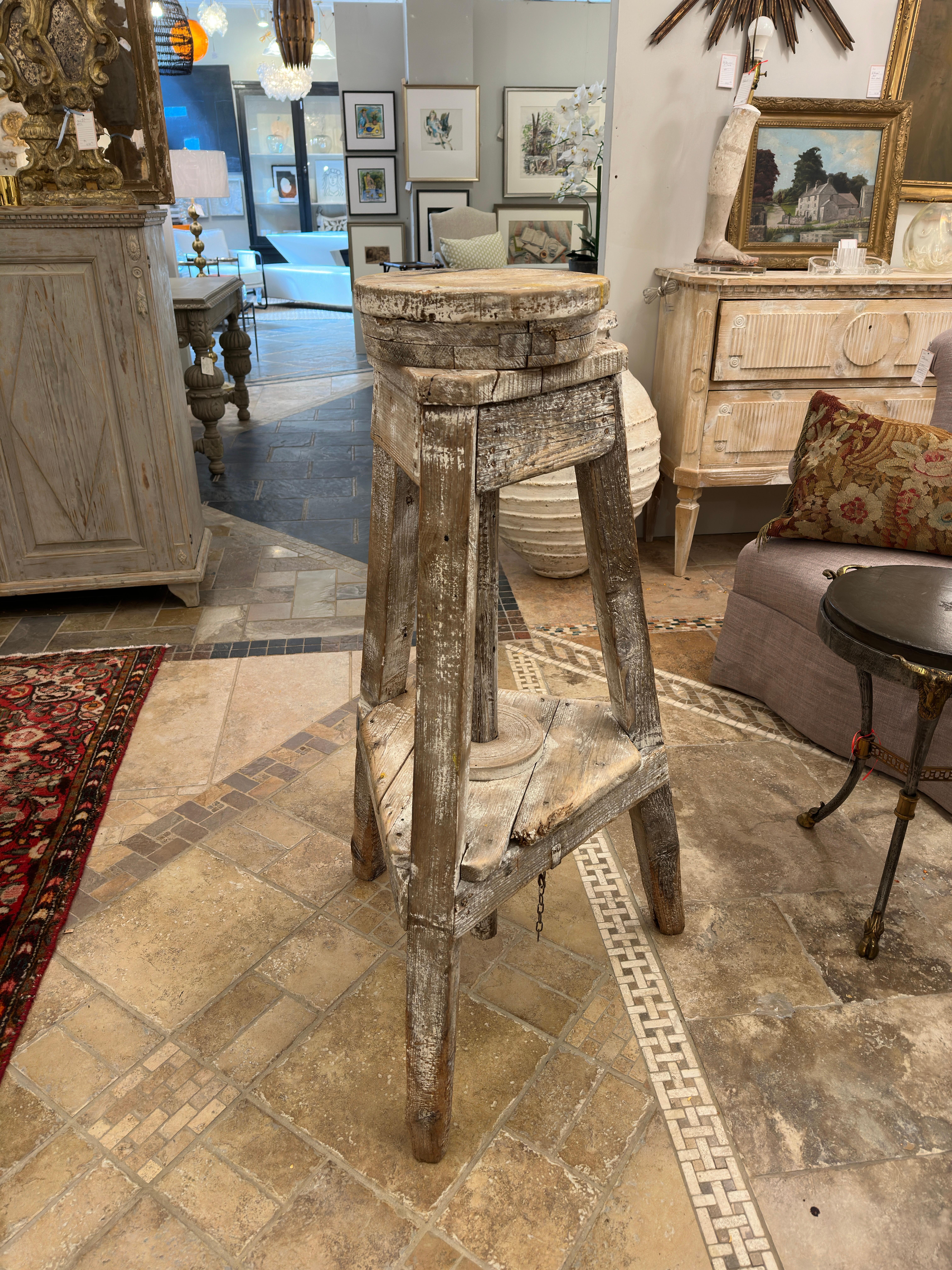 The 19th-century French sculptor's stand exudes an aura of artistic history and practicality. Crafted with meticulous attention to detail, its three legs provide stability while allowing for mobility, essential for a sculptor navigating around their
