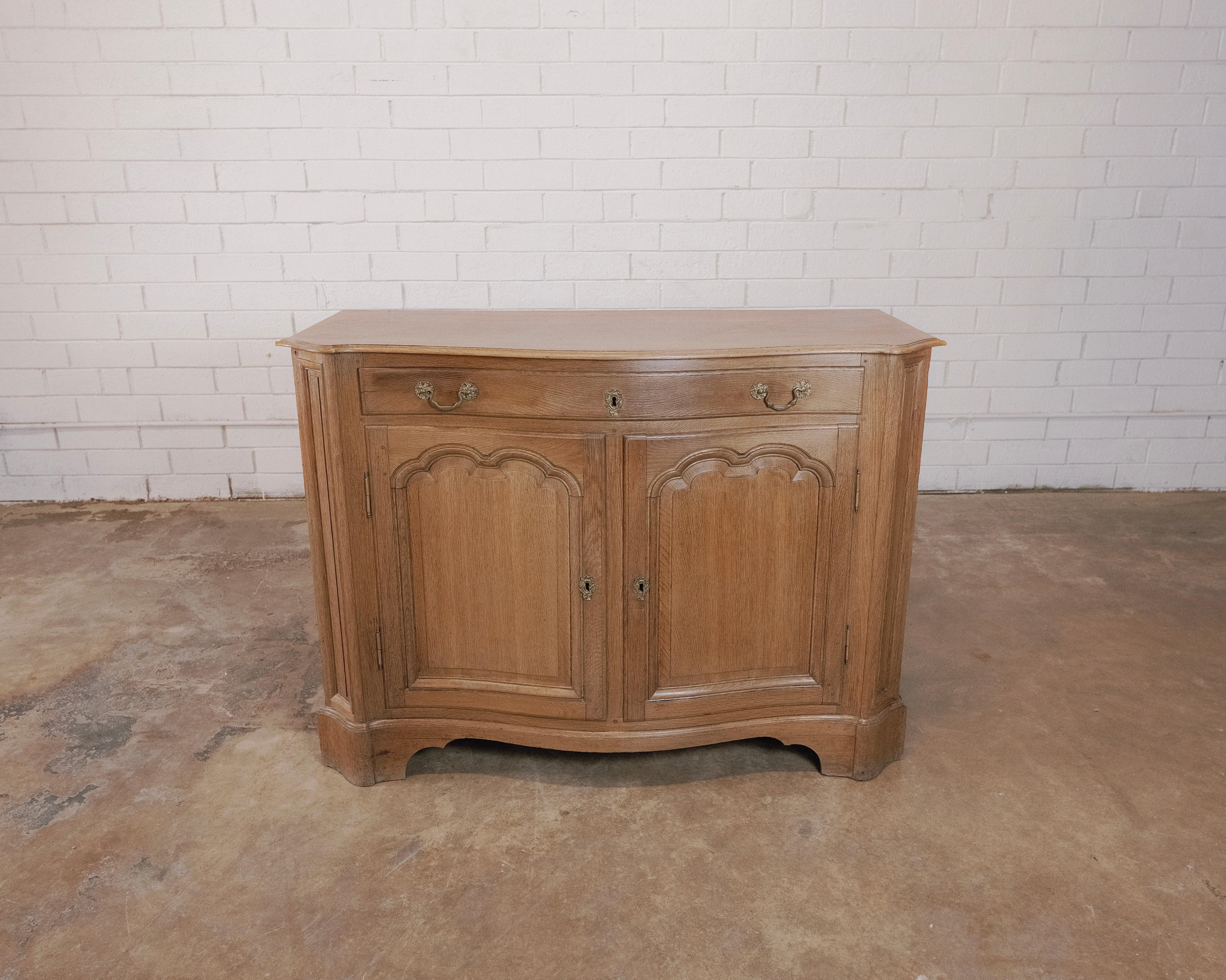 Step into the elegance of the Early 19th Century with this exquisite French sideboard, a true masterpiece of the neoclassical style that defined the era. This sideboard represents not just a piece of furniture but a portal to a bygone time, where