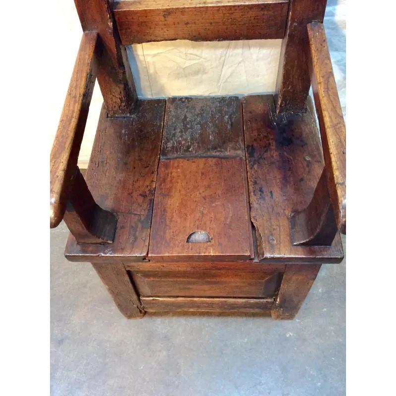 Found in the South of France this early 19th century arm chair features a partial removable seat for storage. Handmade and brutalist in style this chair will be the perfect addition any room, a large kitchen, hallway, children's bedroom or by the