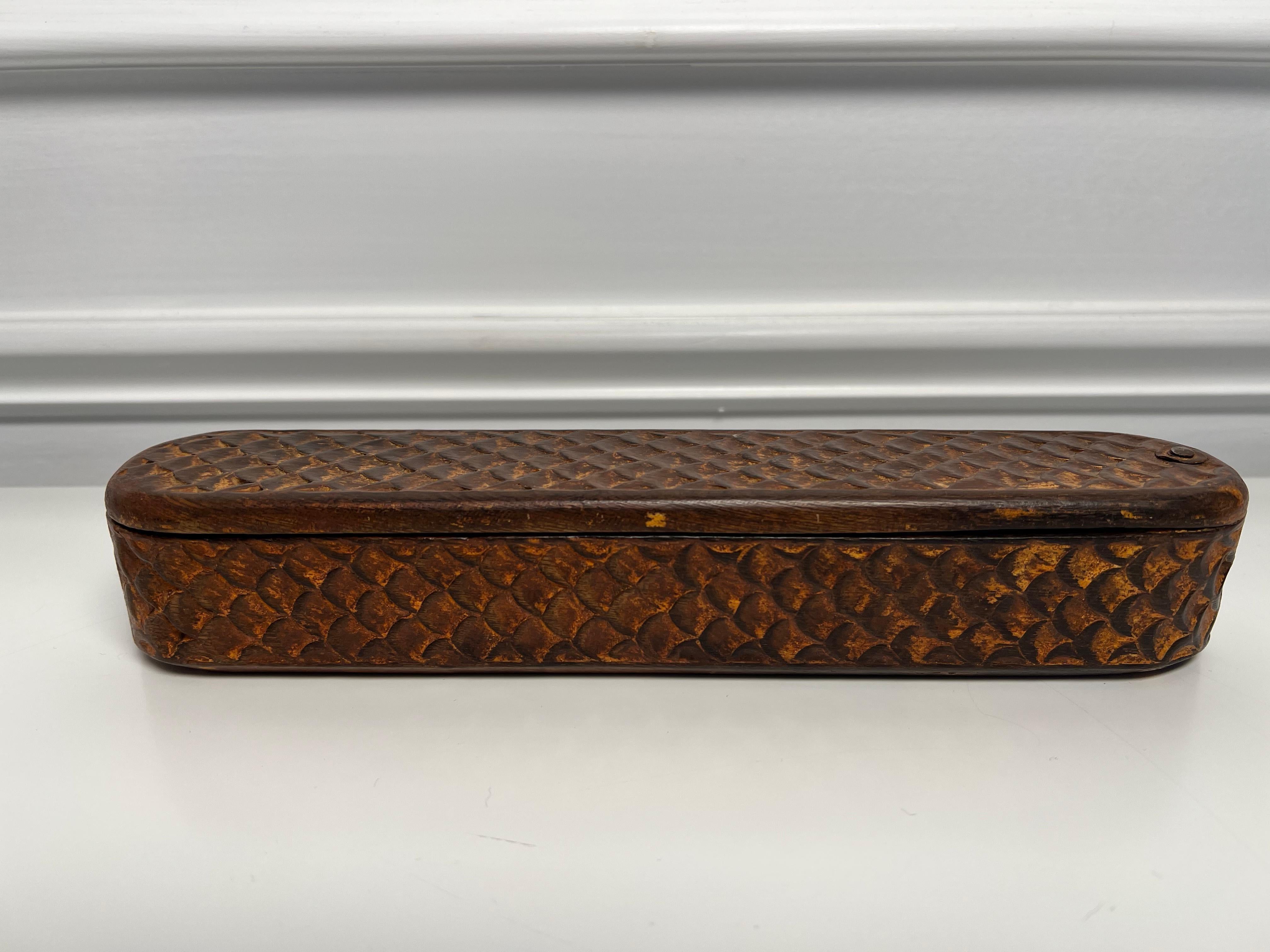 Early 19th Century hand carved wooden pen box with a swing top and space for an ink well and pens. French circa 1910 this would be a nice piece for someone who collects ink wells or antique pens. Its one of the many pieces from a private collector