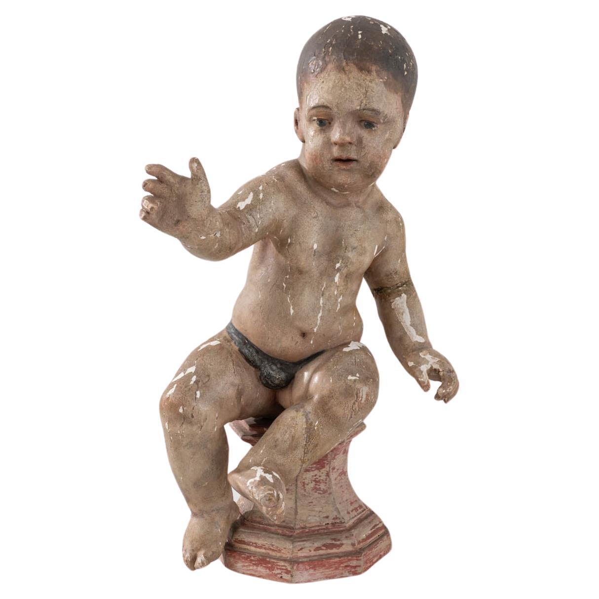 Sculpture en bois française du début du 19e siècle représentant un jeune enfant en vente