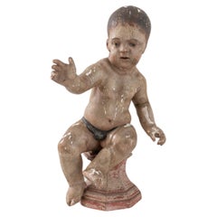Sculpture en bois française du début du 19e siècle représentant un jeune enfant