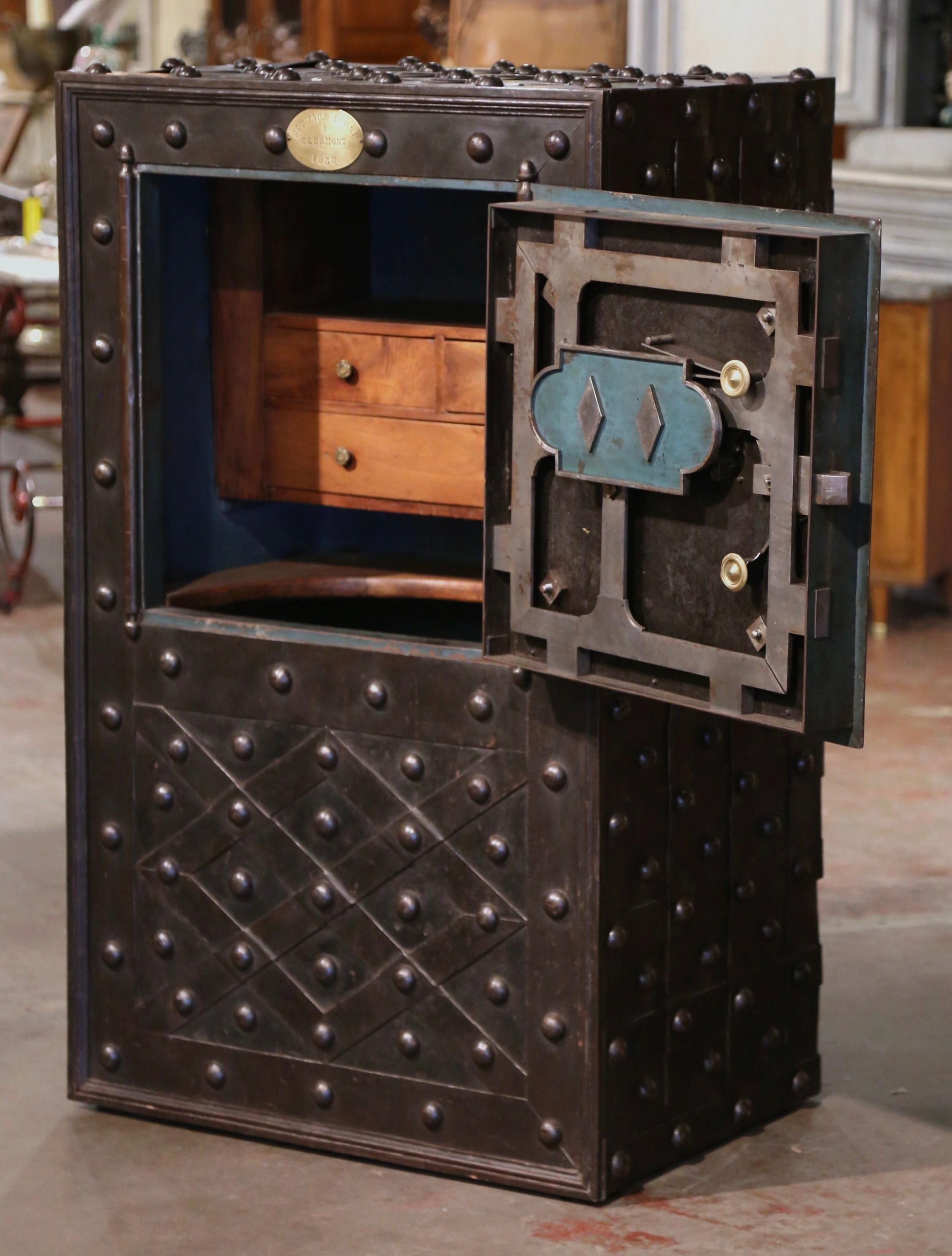 Keep your valuables and documents in this important antique hobnail safe. Manufactured by Magaud de Charf in Clermont, France, the monumental wrought iron safe is decorated with nail head motifs on all four sides and has an all-original, working