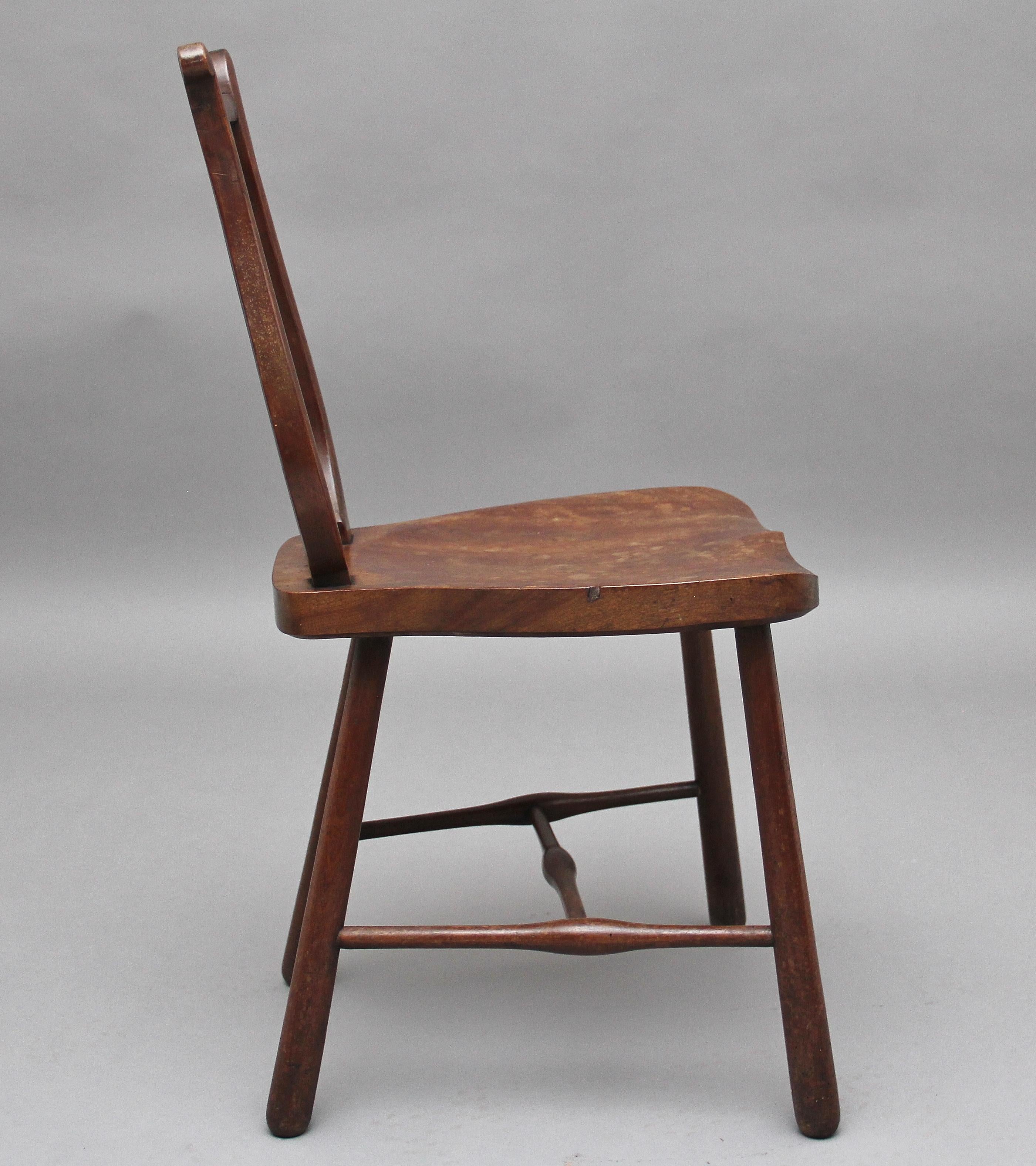 A lovely little early 19th century fruitwood country side chair, having a harp back incorporating four finely turned spindles, solid saddle seat, supported on out swept turned legs united by side and central stretcher, circa 1800.
