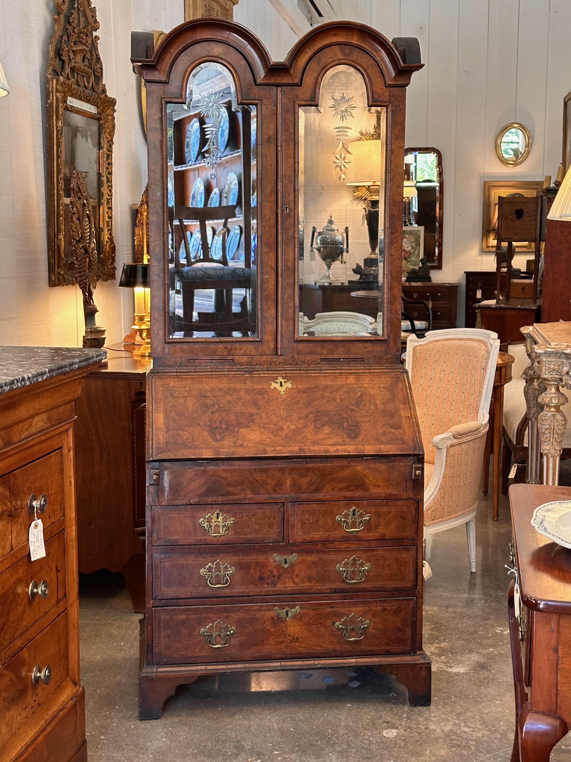 A petite size secretary with lots of style. Mirrored doors are beautiful.