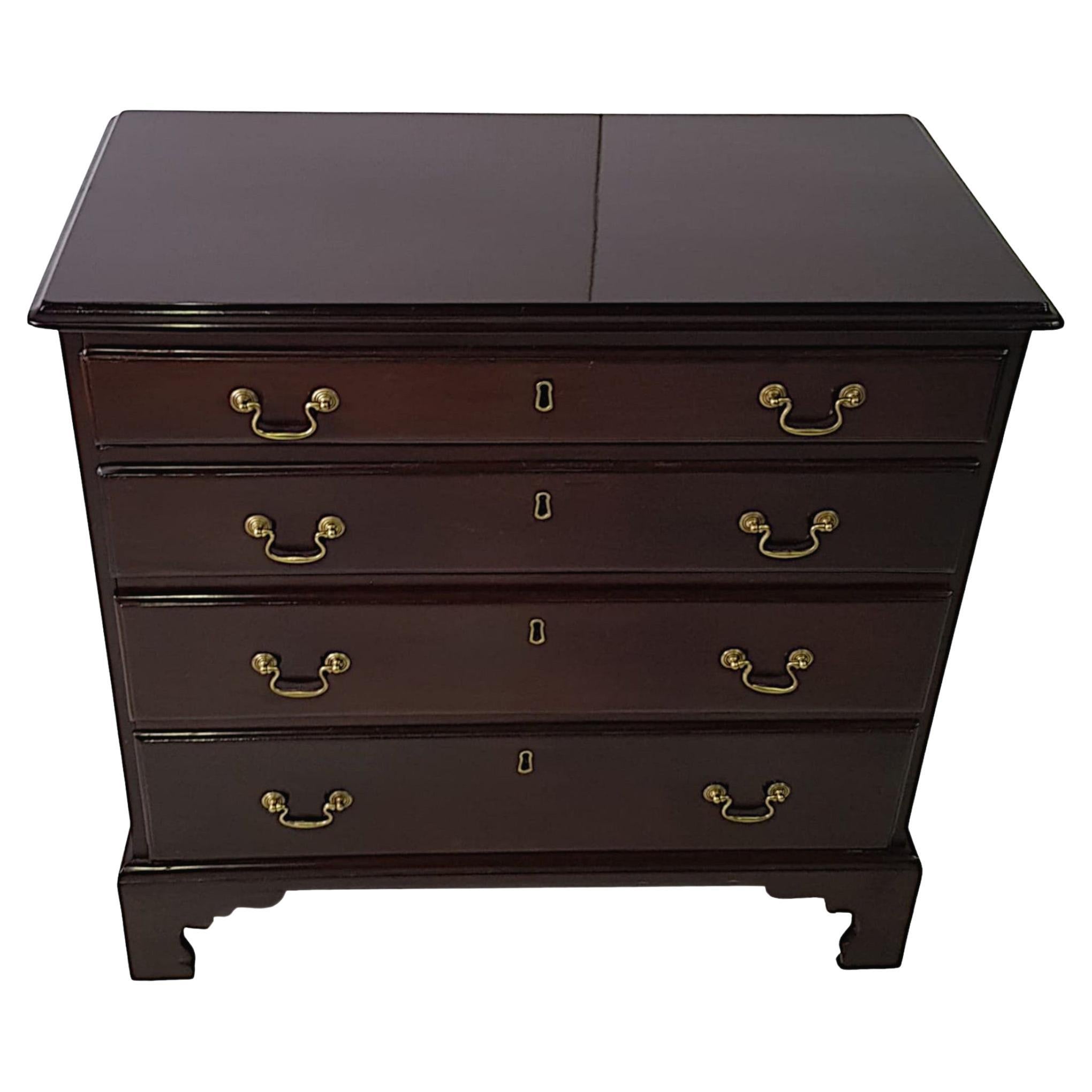 A superb early 19th century George III mahogany chest of drawers, the shaped and moulded top raised over four long, cockbeaded and graduated drawers with brass escutcheons and decorative ring pulls supported on finely carved ogee bracket feet.