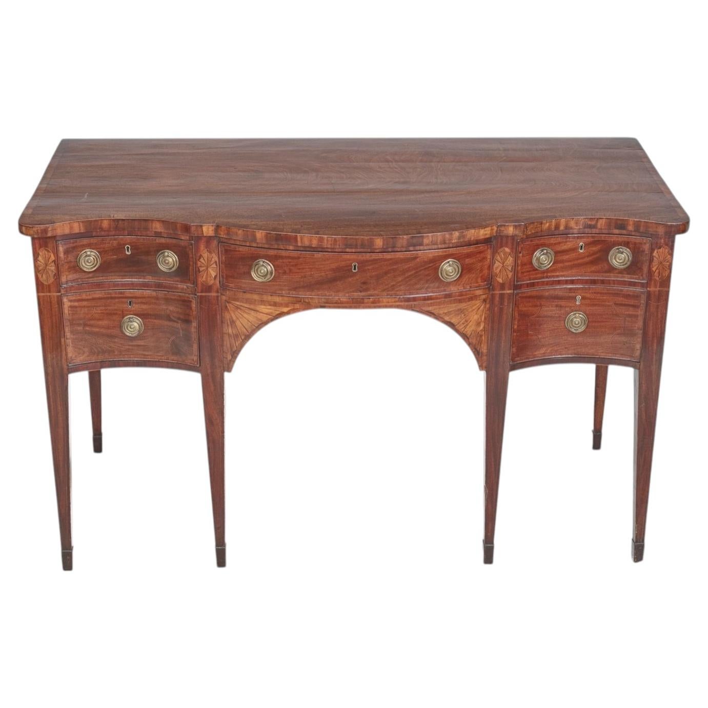 Early 19th century George III inlaid mahogany serpentine sideboard