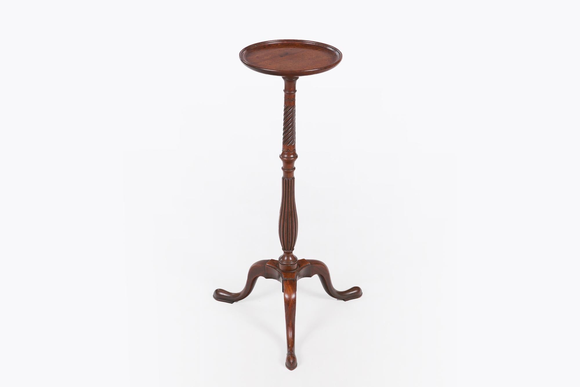 Early 19th century George III mahogany wine table, the moulded top of circular form raised over turned pod with barley twist and baluster carved reeded detail supported on triform moulded cabriole leg terminating on snake foot.