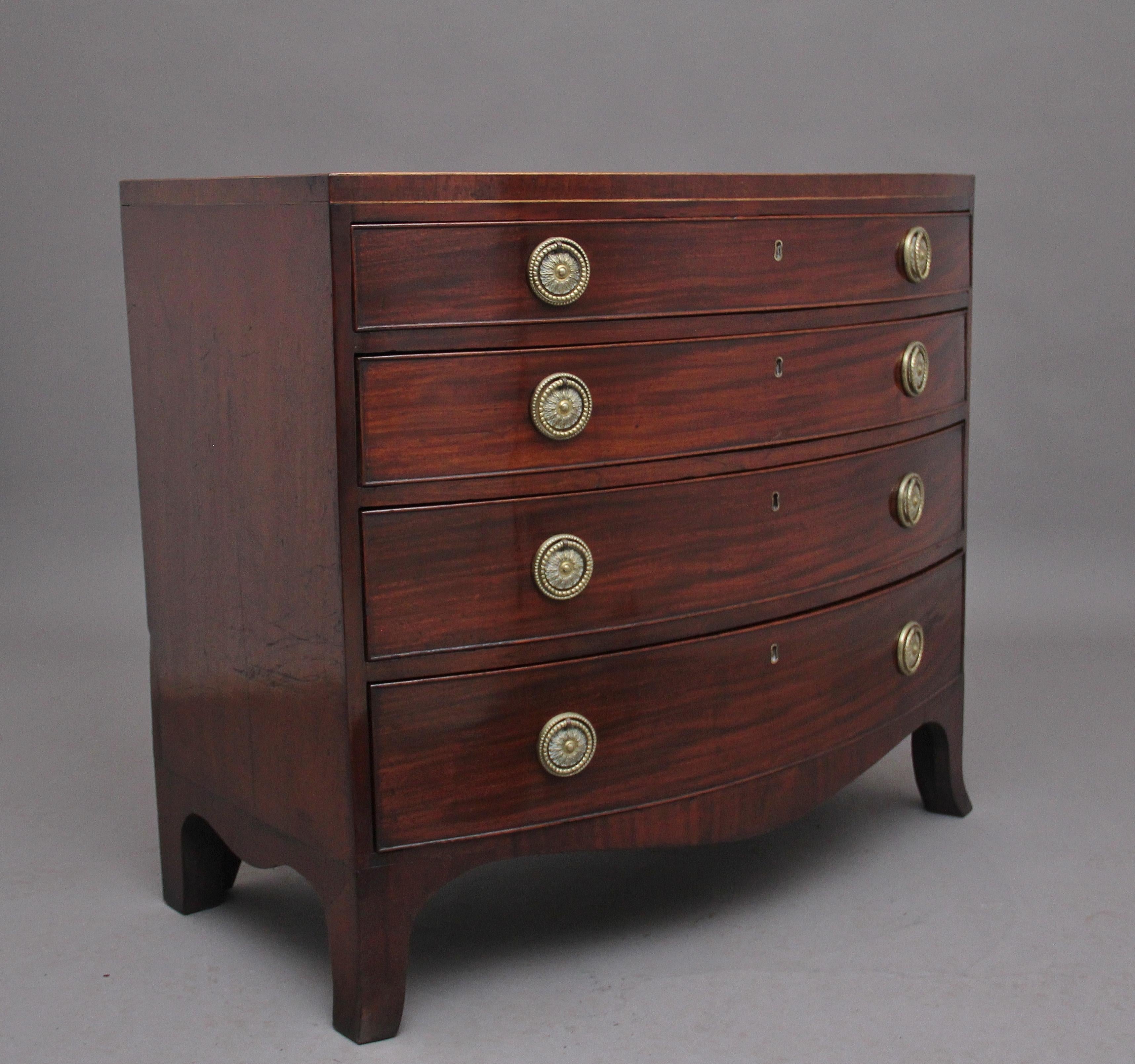 Early 19th Century mahogany bowfront chest of drawers of nice proportions, having a lovely figured top above a selection four long oak lined graduated drawers, with brass engraved ring and plate handles, shaped apron on the front and sides,