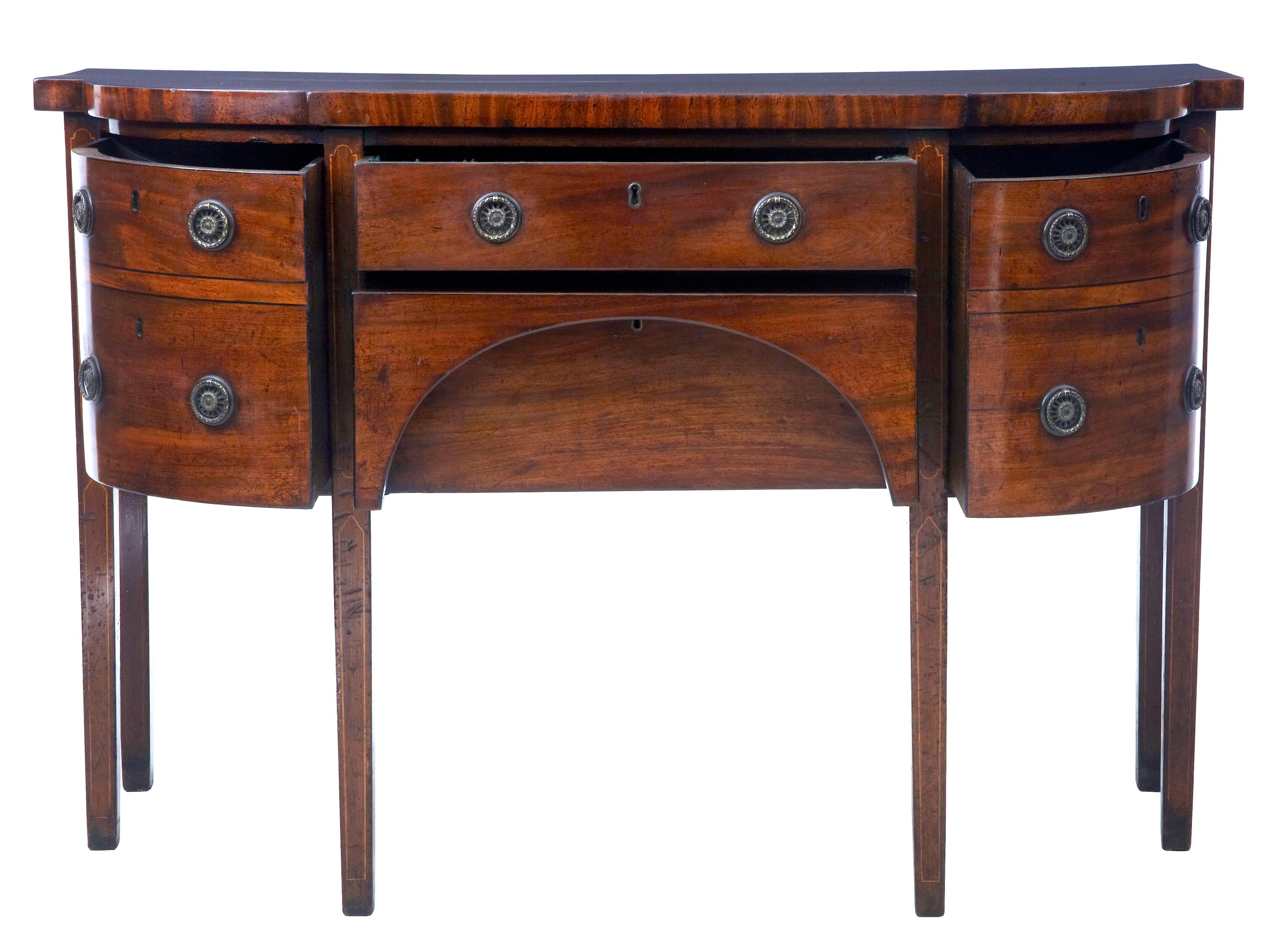 Early 19th century Georgian mahogany breakfront sideboard, circa 1810.

Fine quality late Georgian mahogany sideboard circa 1810. Bowfront and breakfront in shape. 2 drawers to the front and 2 shaped drawers either side. Strung with ebony to the