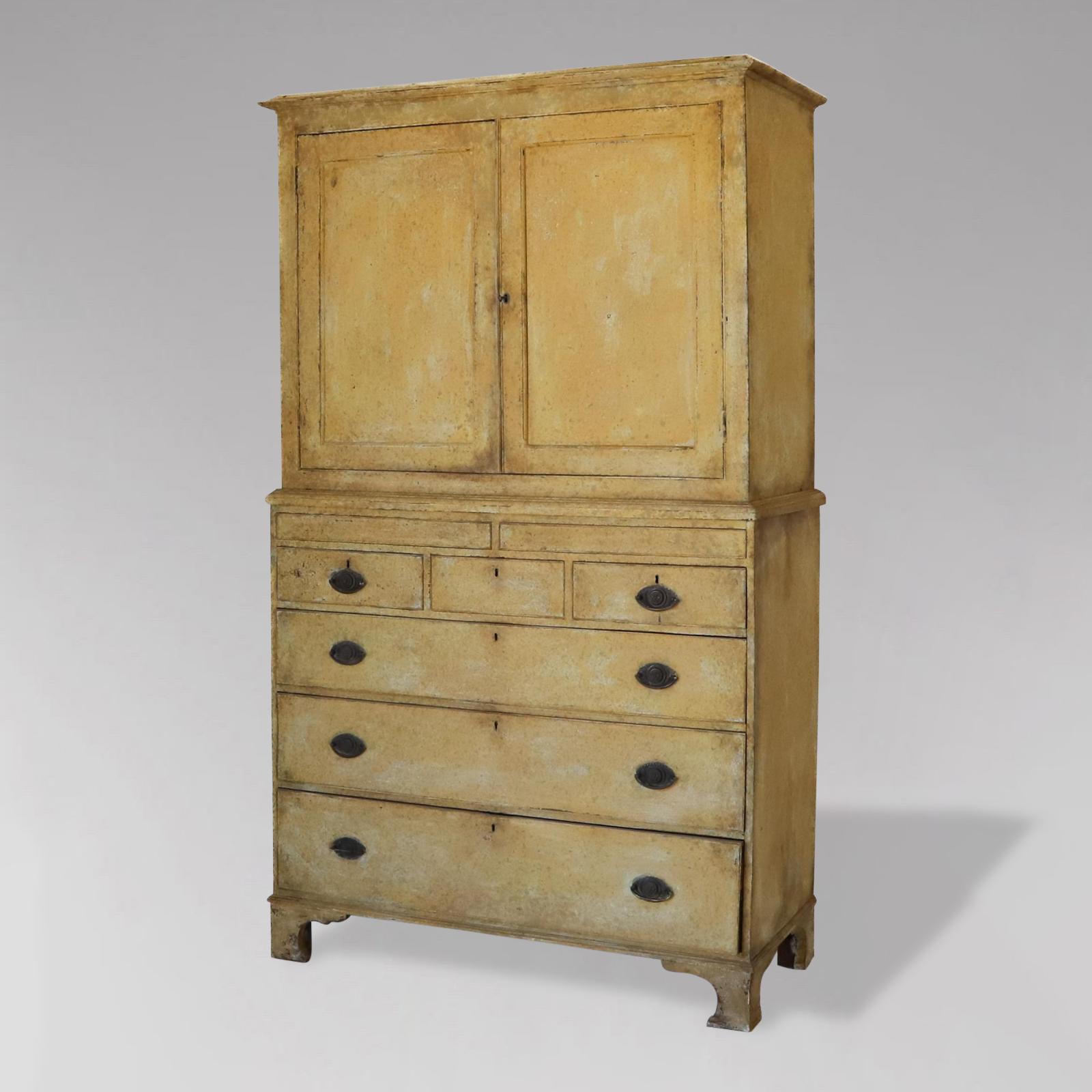 A stunning early 19th century, Georgian period, painted country housekeeper's cupboard with moulded cornice above a pair of panelled doors, enclosing two fixed shelves above two small hidden drawers, three short drawers and three long graduated