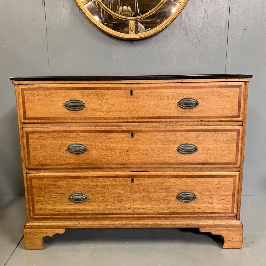 This is a stripped back Georgian oak and mahogany banded chest of drawers with a slate top, circa 1800.
Good decorative piece and with the three long drawers, gives good storage too.
I have fitted the slate top to the chest as this would