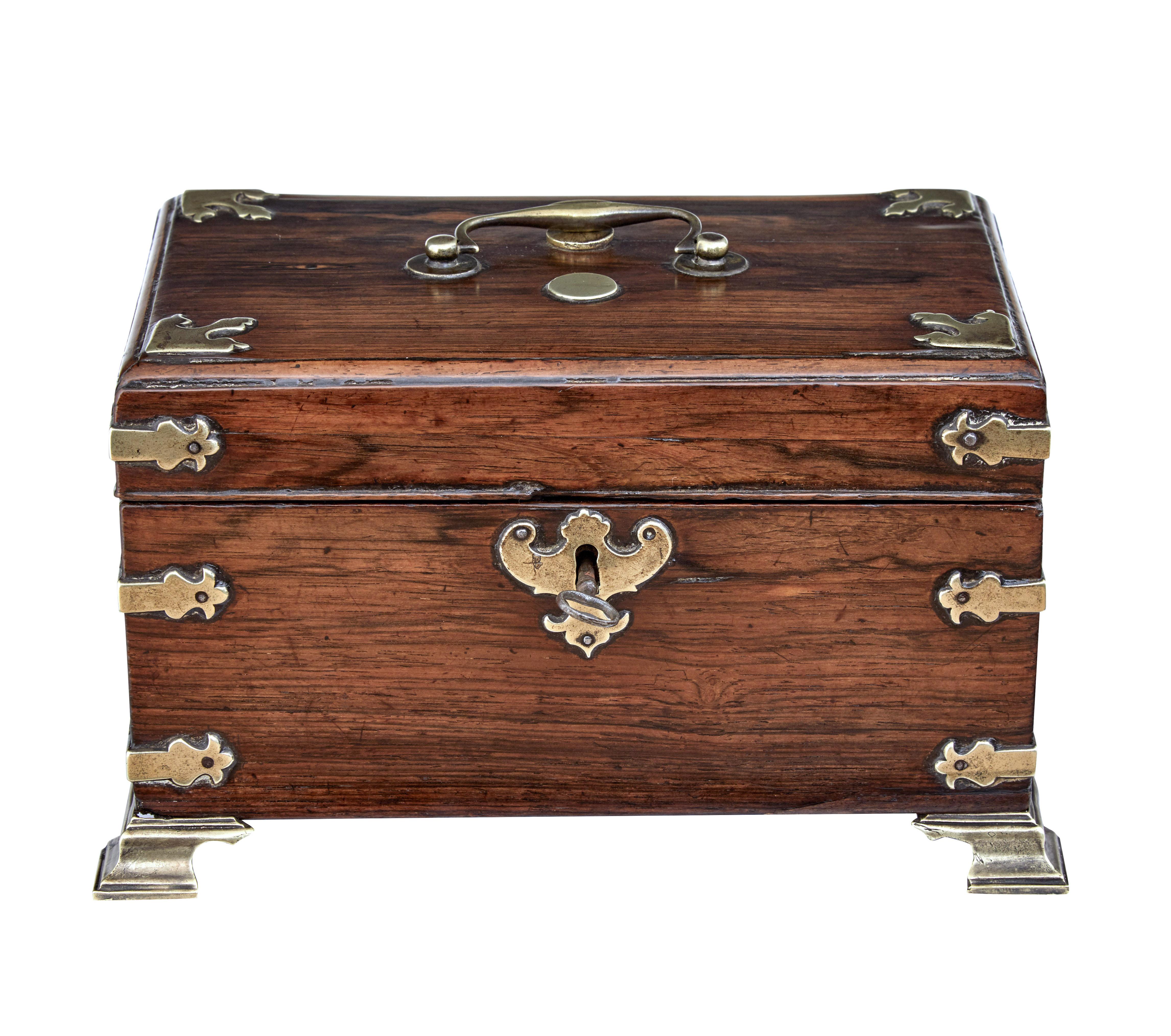 Early 19th century Georgian palisander and brass tea caddy circa.

Fine quality tea caddy from the late georgian made in palisander from the rosewood family.  Decorated with brass embellishments and handle to the top.  Complete with brass