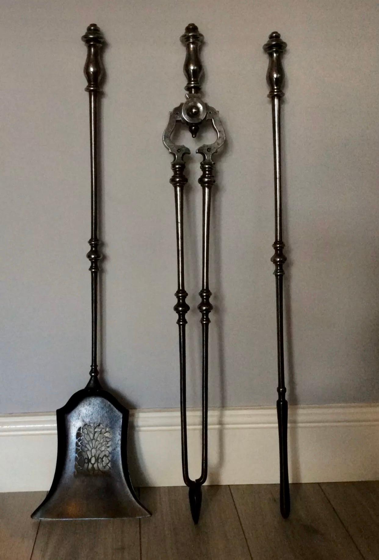 A charming and unusually large set of early 19th century Georgian polished steel fire irons, comprising of a poker, a pierced shovel and tongs, with elegant baluster handles and bobbin shafts.
Scottish circa 1810
Overall length 36