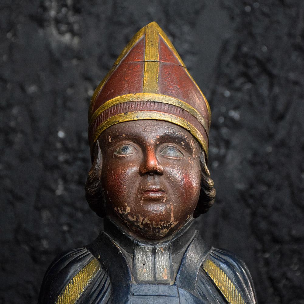 Early 19th century religious artifact 
We are proud to offer an early 19th century hand carved wooden religious statue, in the form of a bishop. Covered in its original polychrome paint and demonstrating some utterly amazing craftsmanship in its