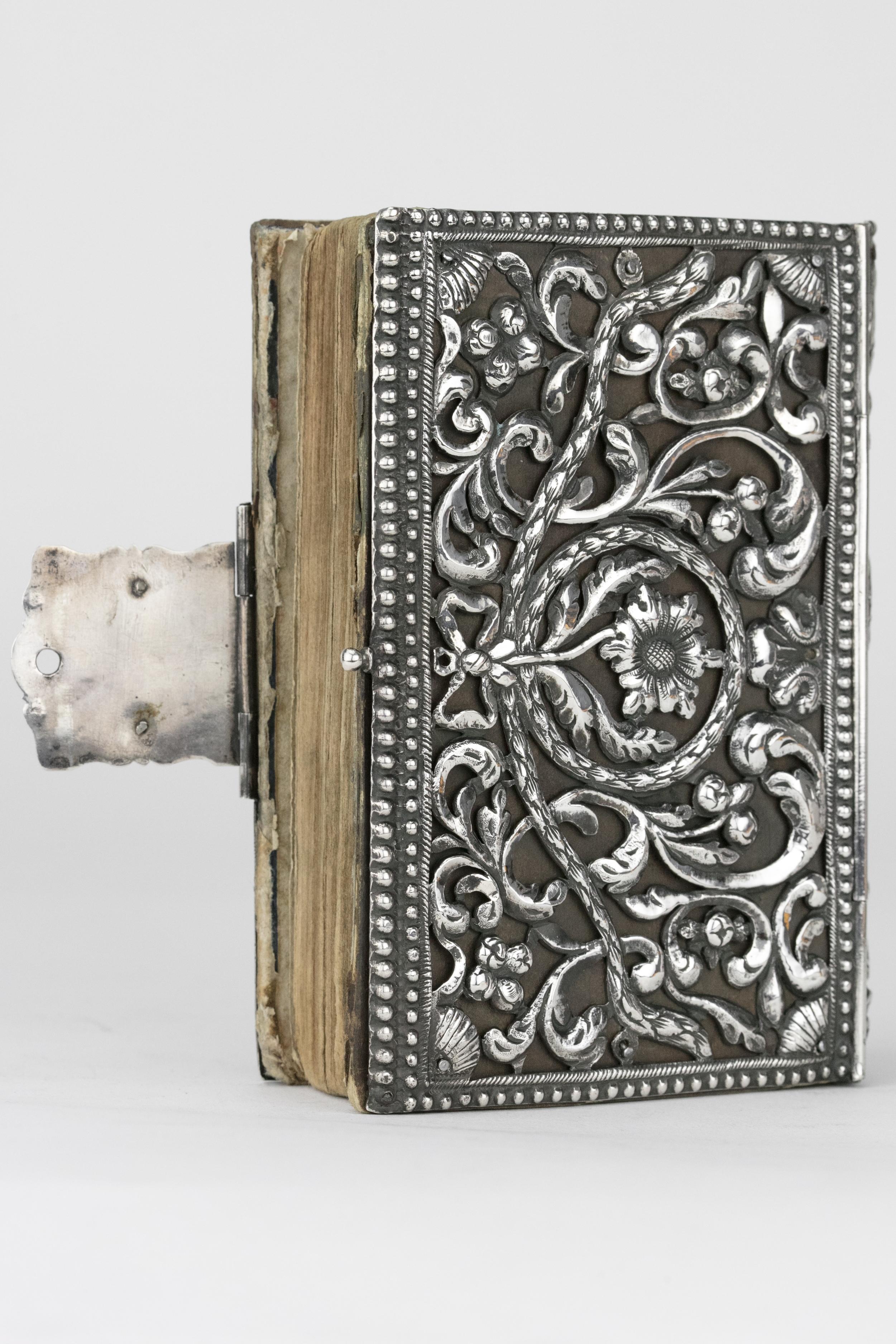 Handmade German silver book binding, circa 1804.
Both covers pierced and chased with foliate scrollwork with ribboned flower, spine chased to match, fitted with the Hebrew Bible, Sulzbach, 1804.

Every item in Menorah Galleries is accompanied by a