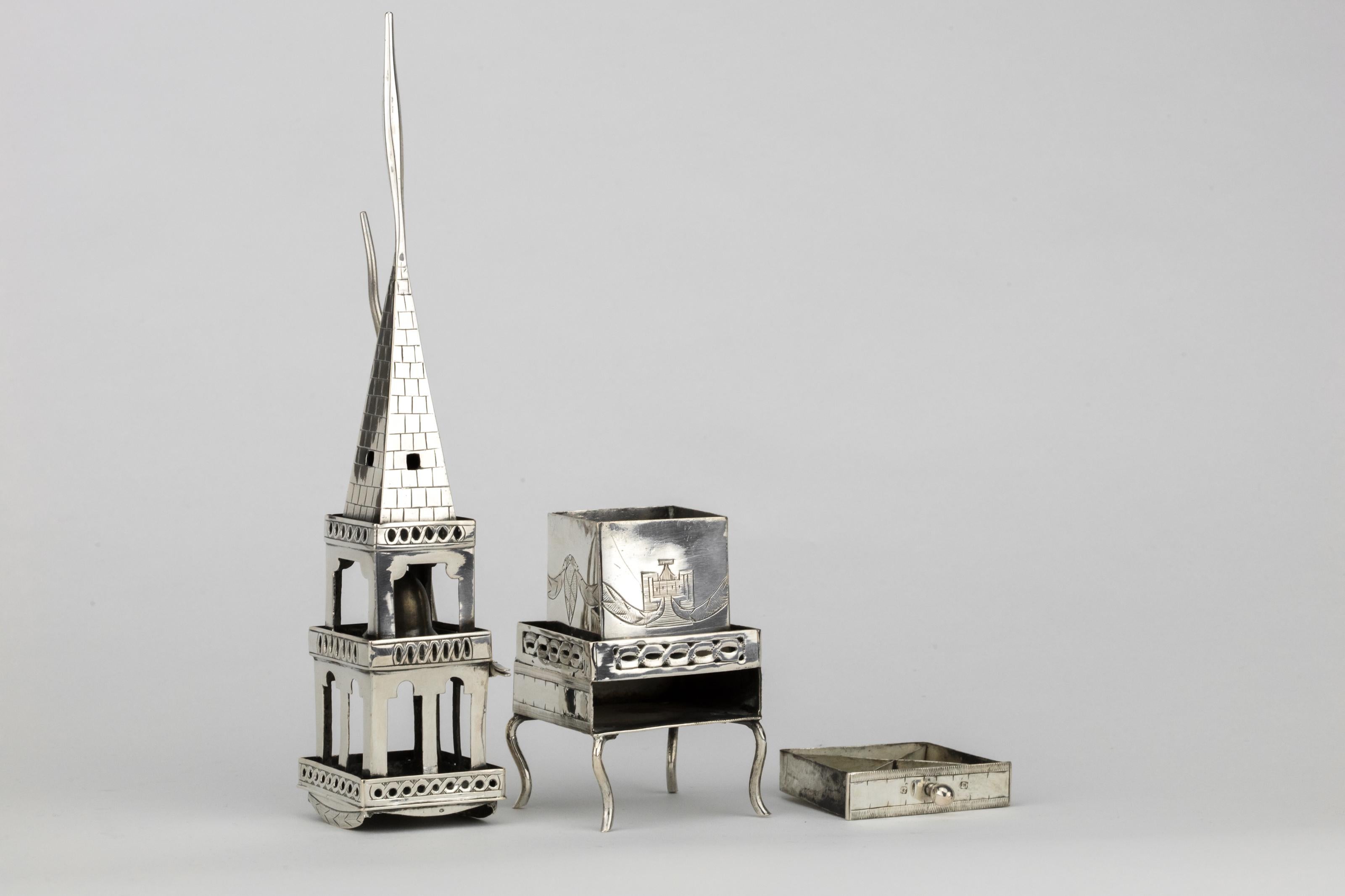 Handmade silver spice tower and Havdalah compendium, Lemberg, Habsburg Empire, circa 1800.
The upper part of the tower designed to hold the Havdalah candle decorated with the snake shaped holder, the bottom part contains the spice with a draw for