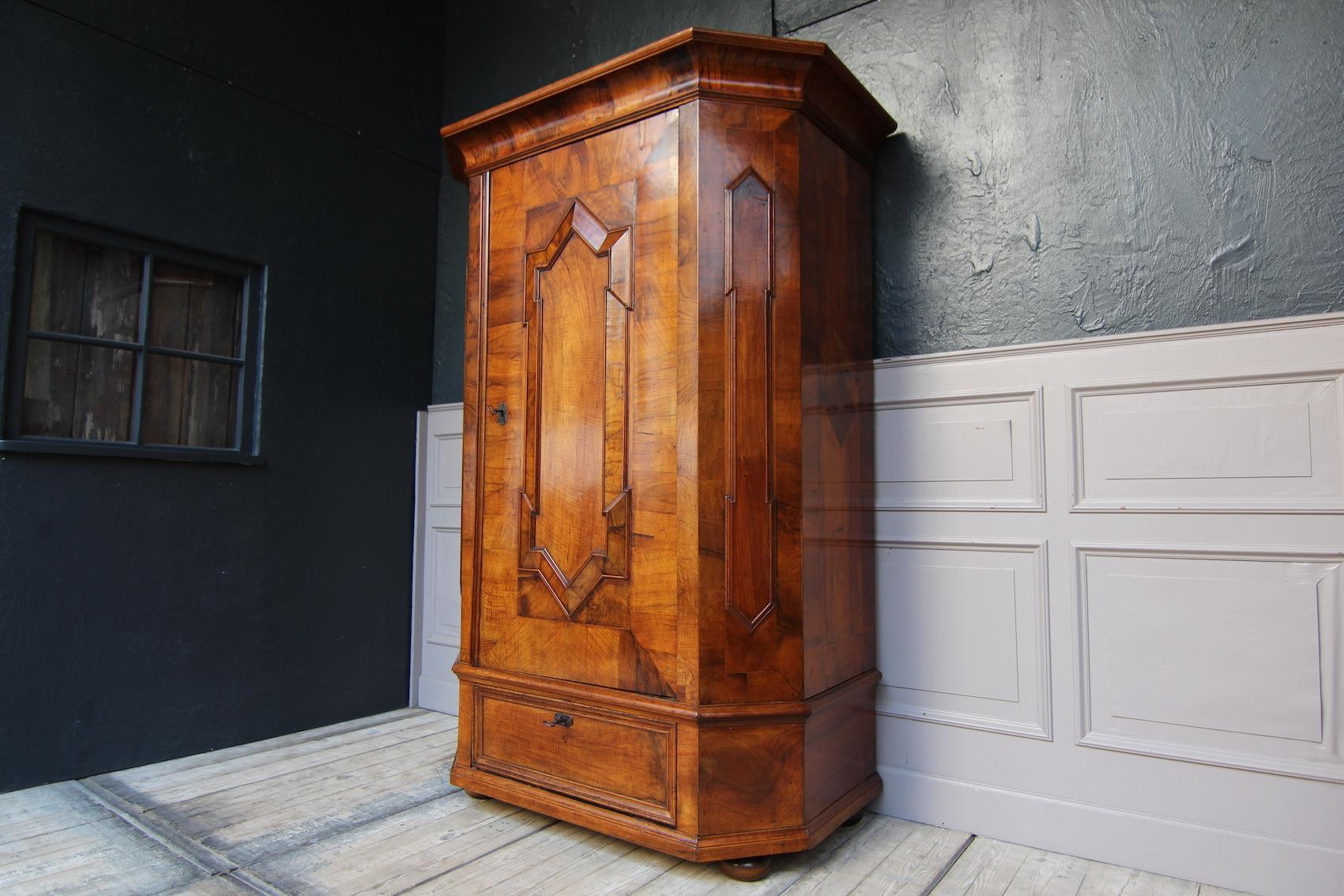 Polished Early 19th Century German Single Door Baroque Cabinet