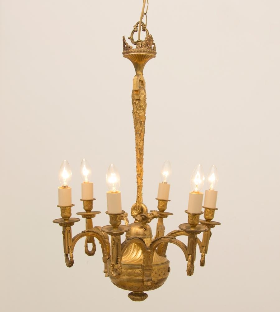 An early 19th century gilded and brass centre chandelier.

This has been fully rewired.It is extremely good quality casting and has probably an ecclesiastical history to it.It also might well be older than we have it listed.