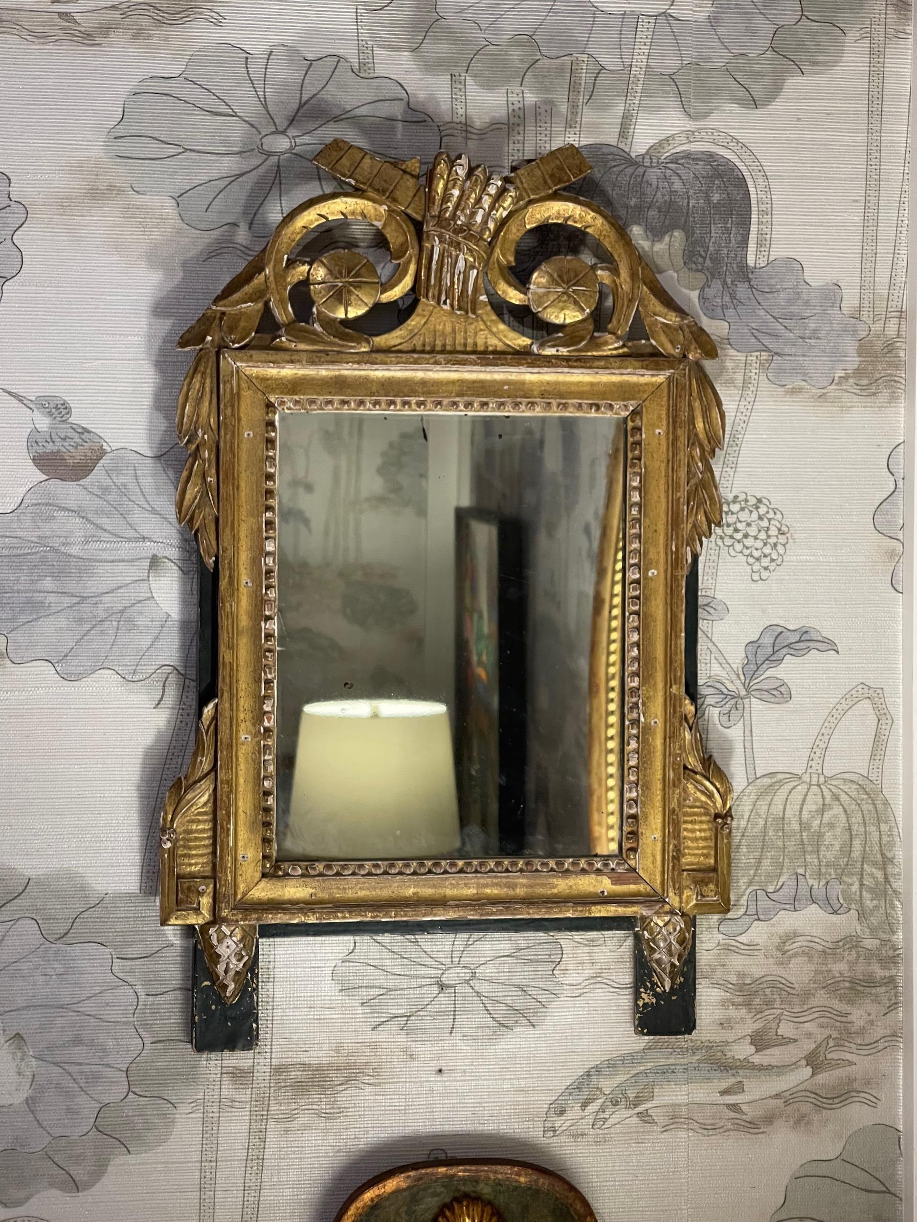 A cute French painted mirror with gilt decoration. A nice piece.
