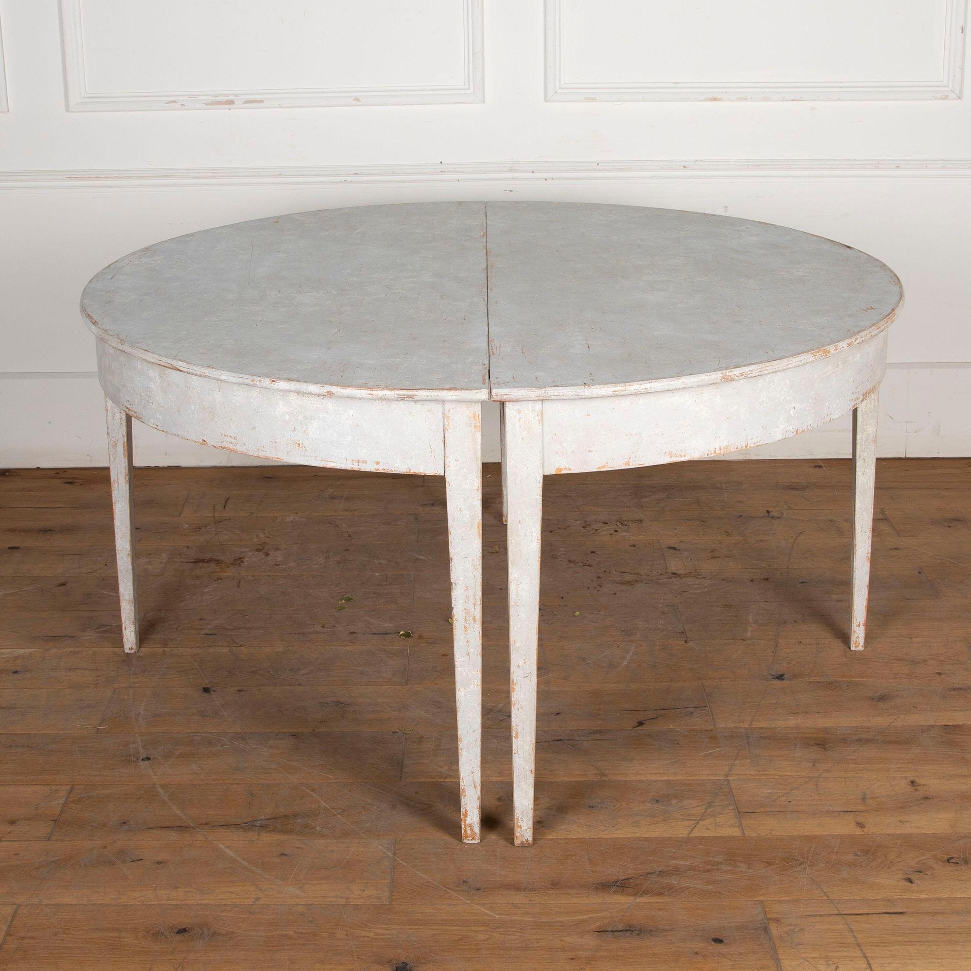Early 19th century Gustavian extending dining table comprising two demi lunes, and two leaves.
Each demi lune : H 75 x W 146 x D 72cm.
Each leaf: W 146 x D 60cm.