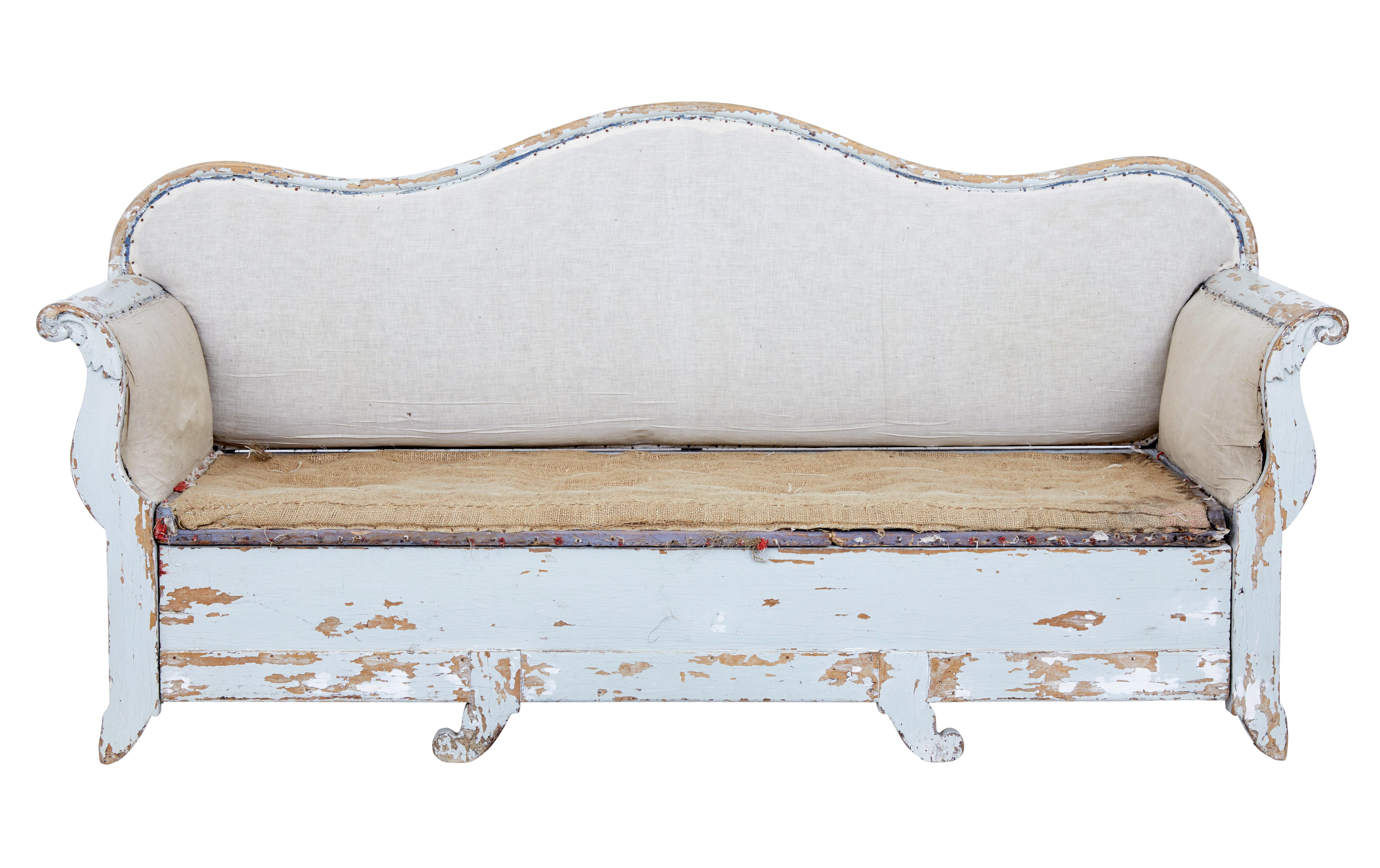 Early 19th century Gustavian painted pine sofa bed, circa 1820.

Good quality piece of rustic Swedish furniture. Large in scale with a deep shaped back. Scroll carved arms. Removable seat allows the bottom section to be pulled out and be used as a