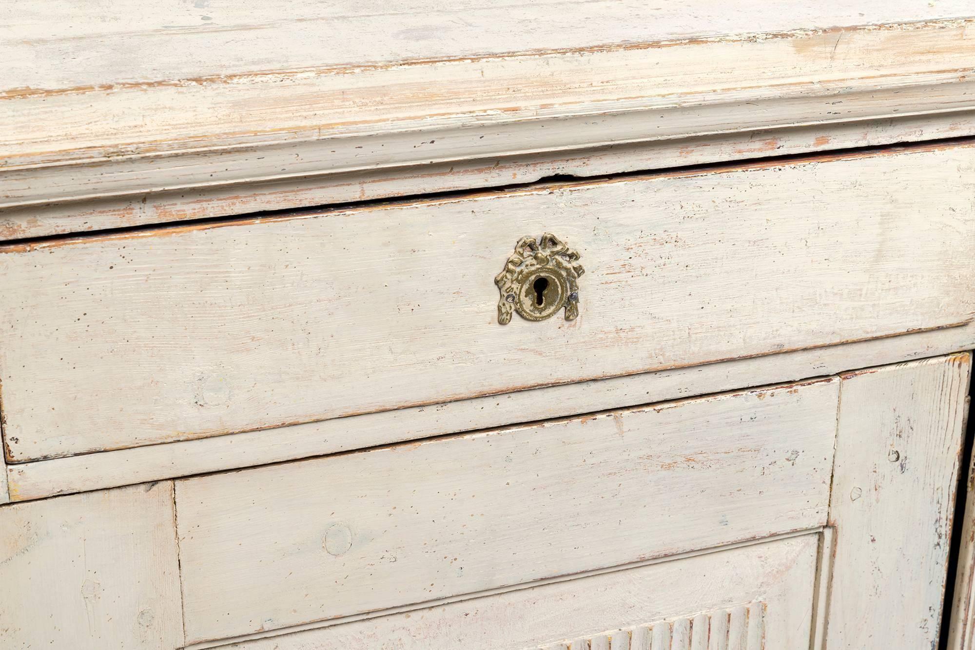 Early 19th century cream painted Gustavian sideboard.