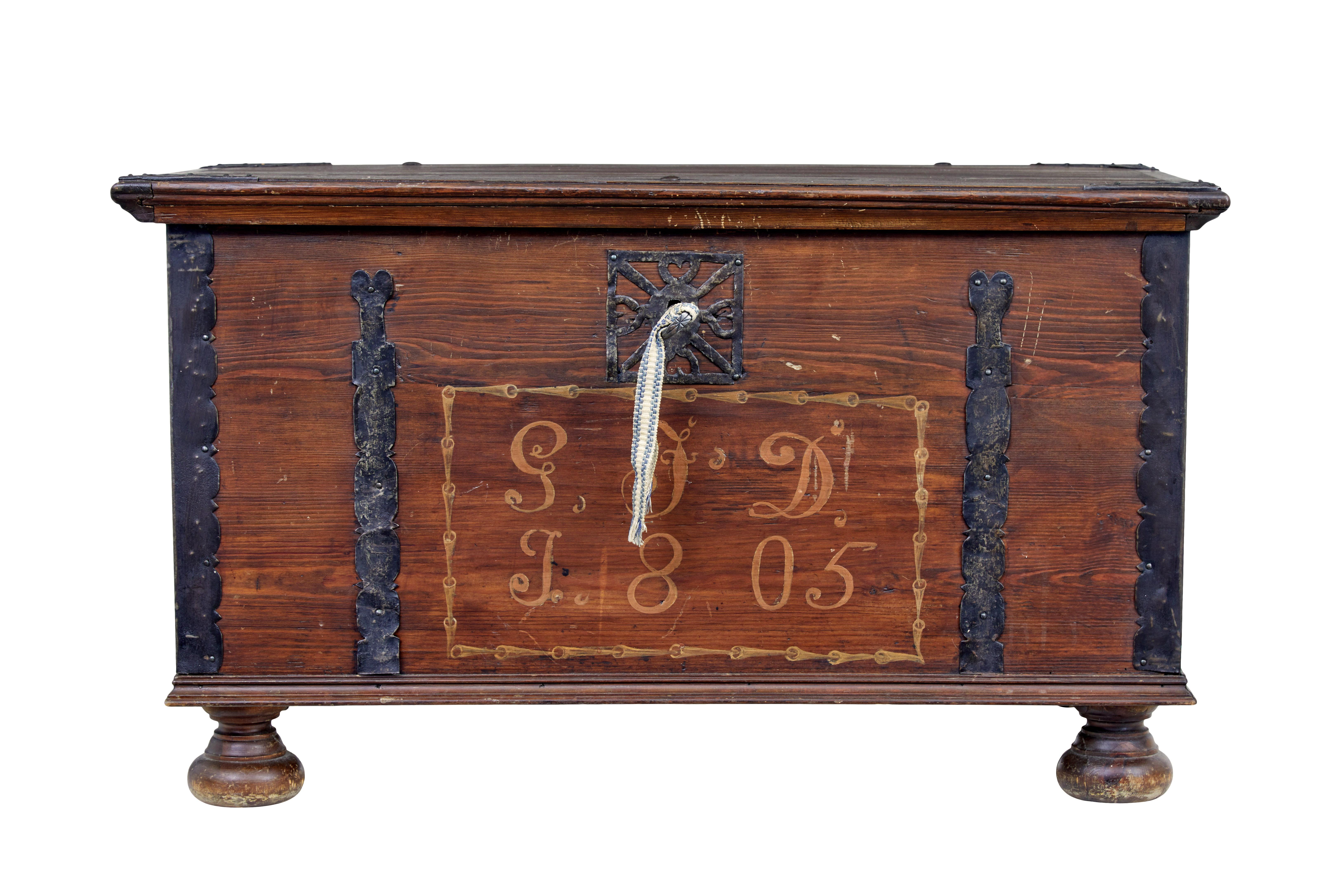 Early 19th century hand decorated swedish pine coffer circa 1805.

Real piece of rural swedish woodwork from the early 19th century.

Pine rectangular box, which has been stained a dark brown, complete with original metal strap work and hinges,