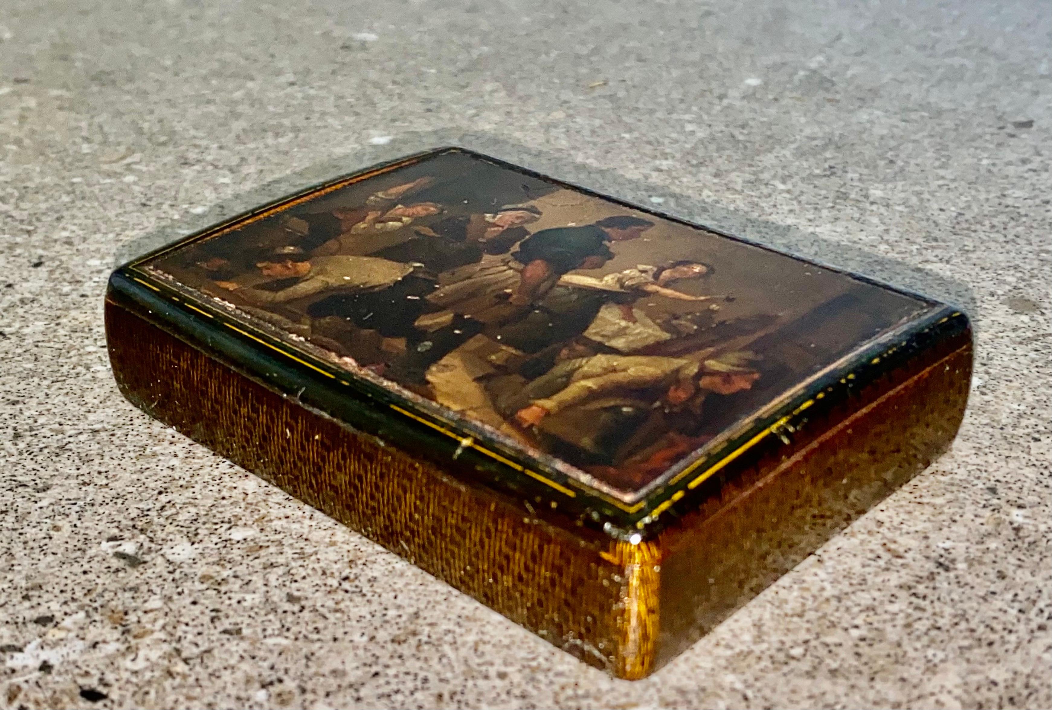 A superb quality large early 19th century rectangular papier mache table snuff box with hand painted interior scene Circa 1800 to 1810. A note inside relating to the original owner.
Overall in very good condition with some light crazing but no