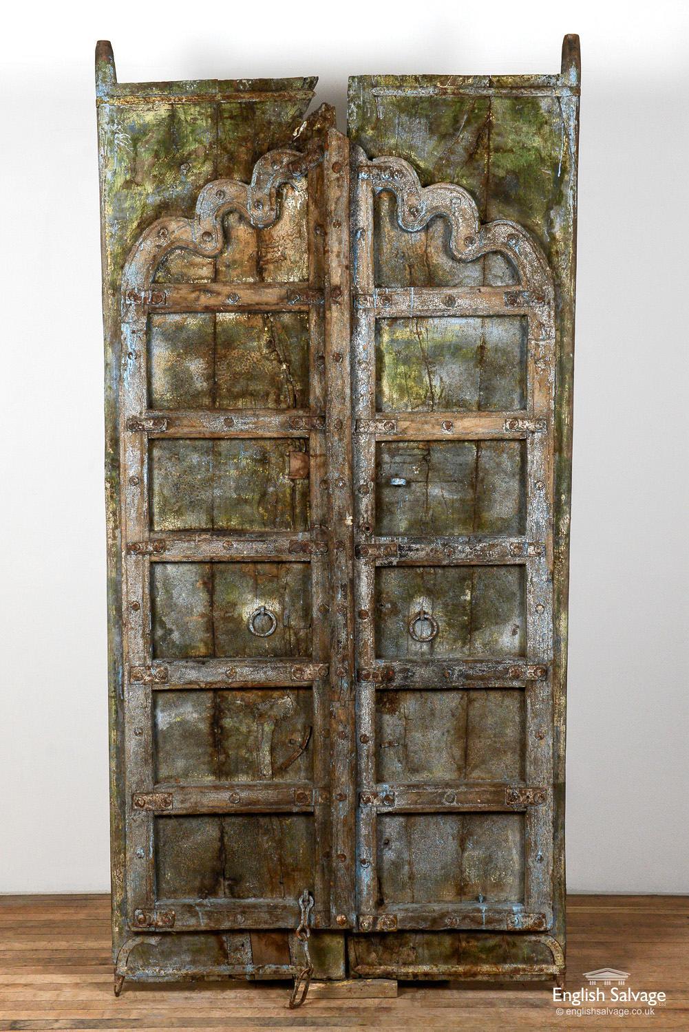 Antique Indian hardwood door dating from early C19th. An overlay giving each door the appearance of having six panels has been attached, with the top section/panel having an unusual 