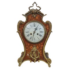 Reloj de incrustaciones con bronces de principios del siglo xix