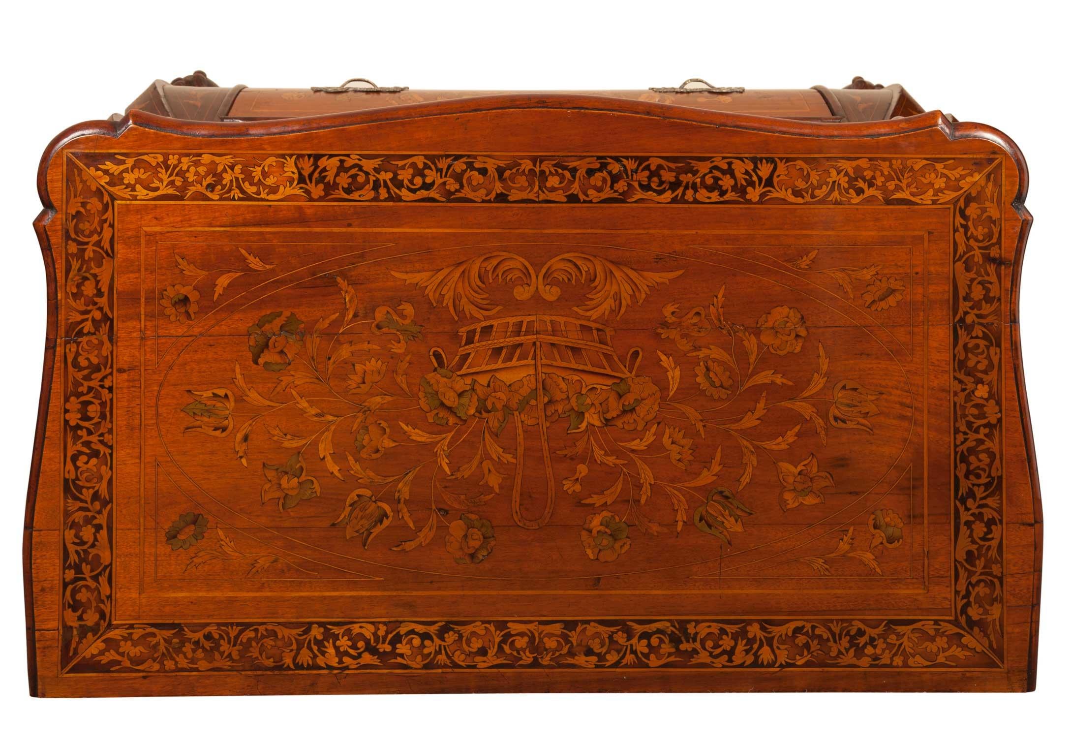 Early 19th century Dutch bombe commode or chest.
Walnut, Floral marquetry inlay throughout, oak lined drawers.