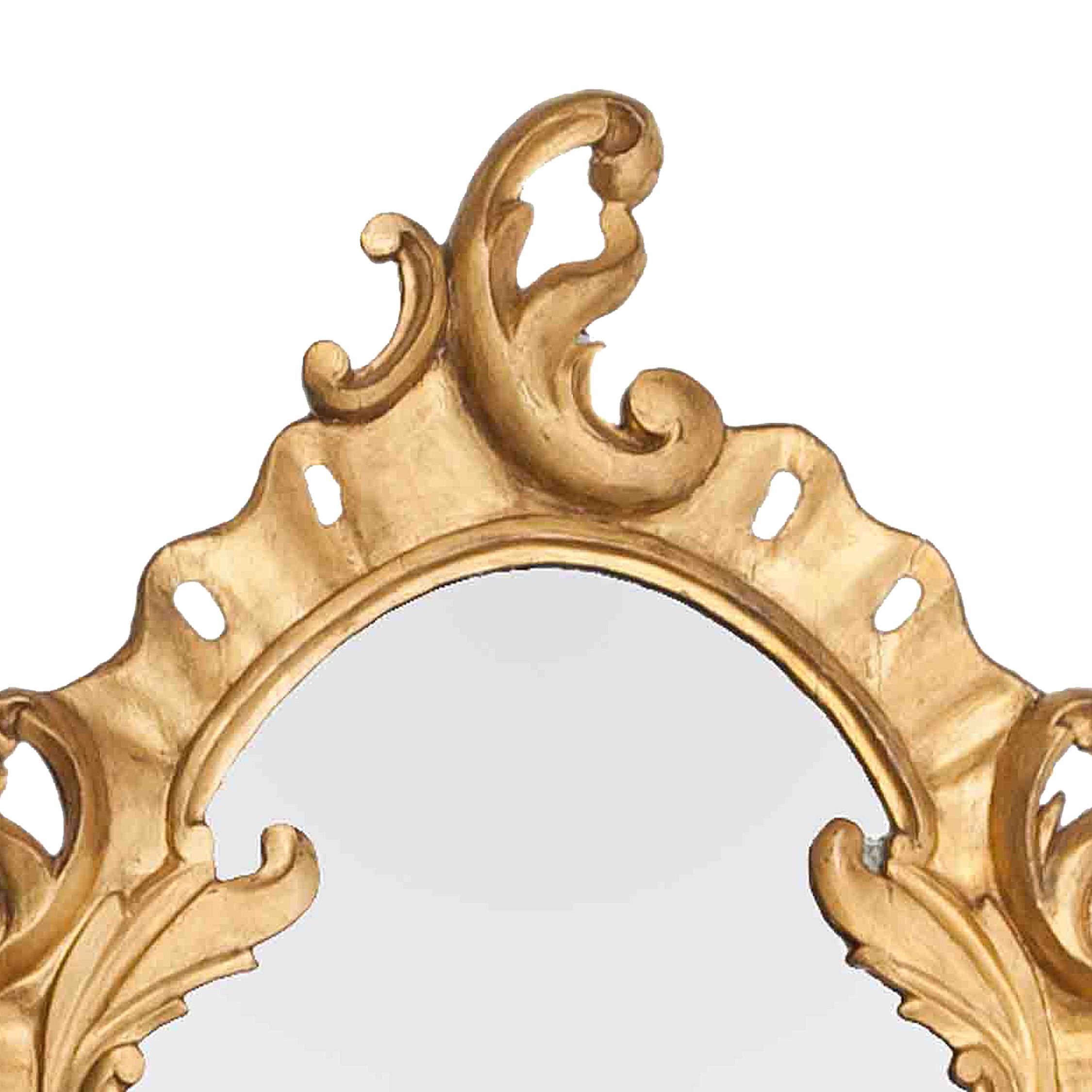 Early 19th century gilt oval mirror with C-scrolls and acanthus leaves.