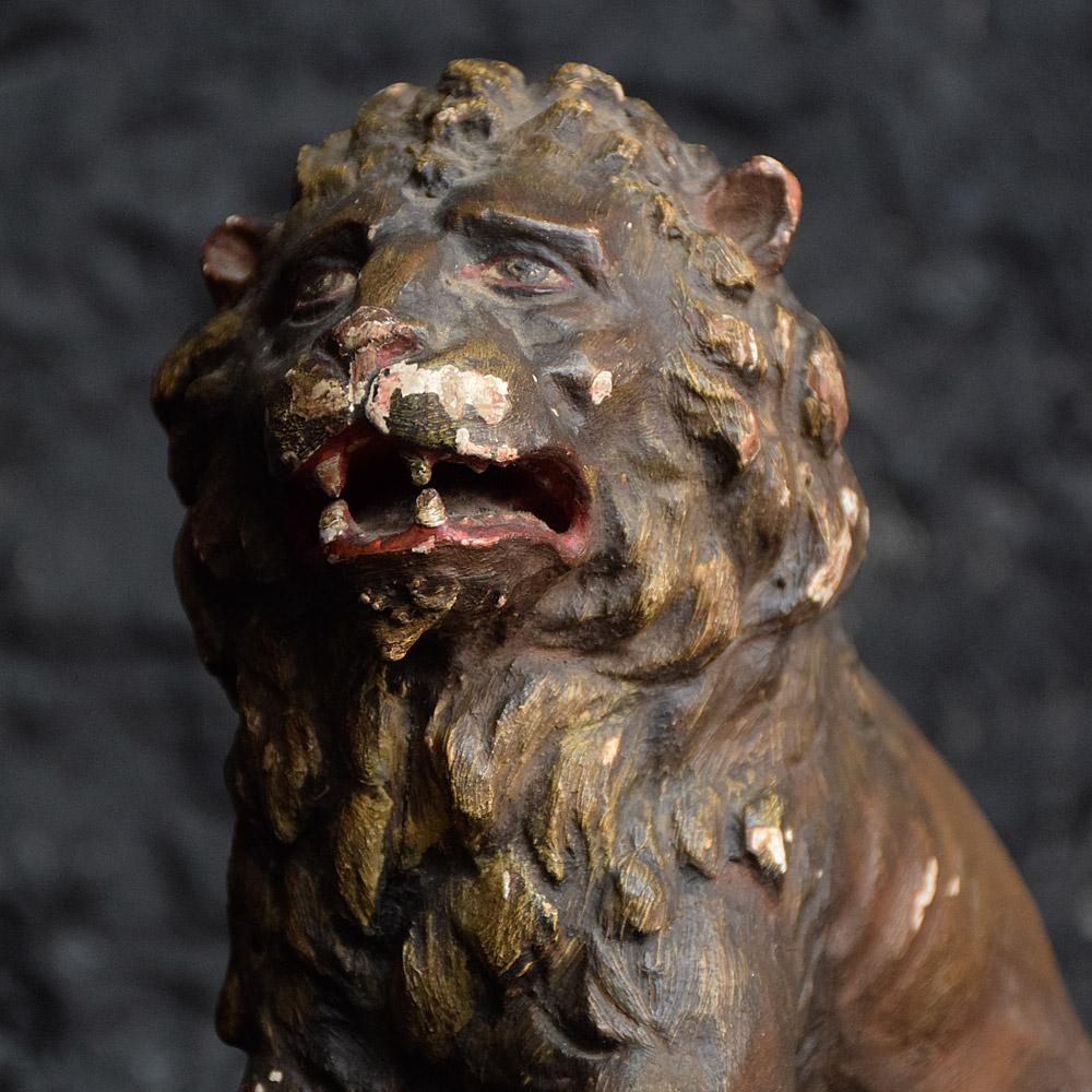 Early 19th century carved lion figure
An early 19th century hand carved Italian or Spanish representation of a seated lion figure. Anthropomorphism features which are typical of this period. Polychrome paint still visible across its surface with