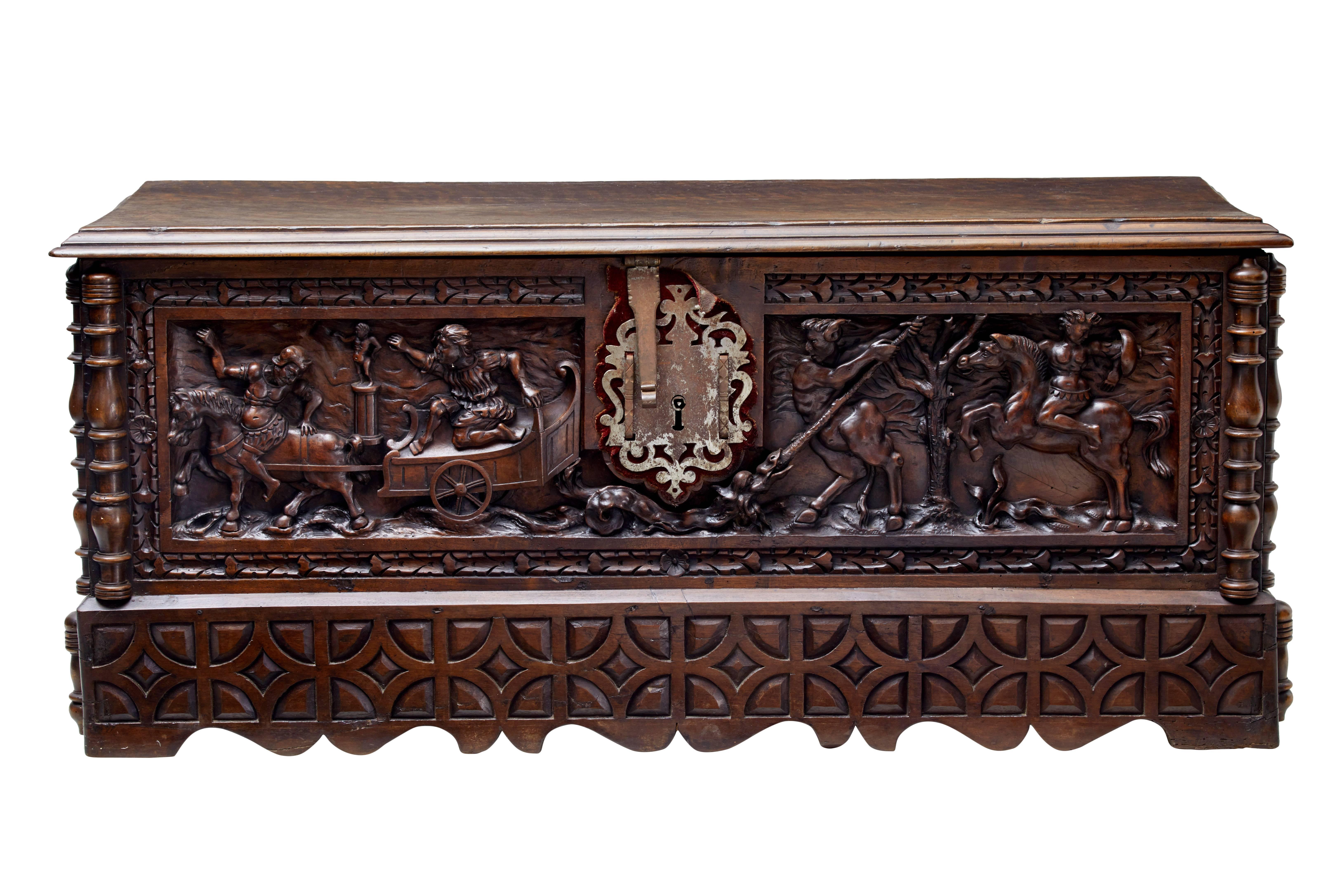Fine quality Italian carved cassone, circa 1800.

Beautifully carved in the solid, depicting figures and mythical creatures to the front panel.

Turned spindles to the corners. Original metalwork, no key.

Standing on shaped and carved