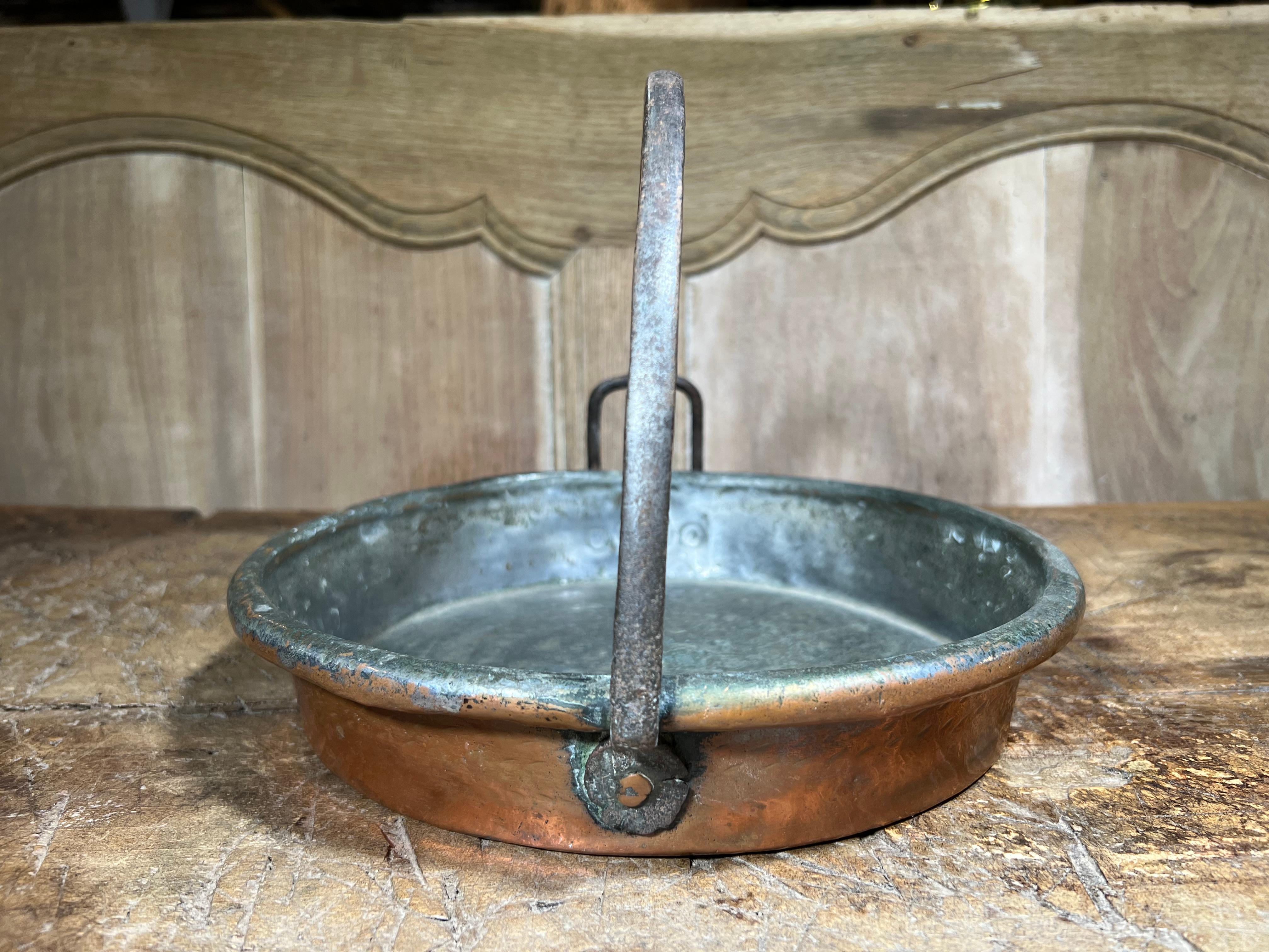 A very charming early 19th century Copper Pan with iron handle from Northern Italy.  A terrific addition to any copper collection.