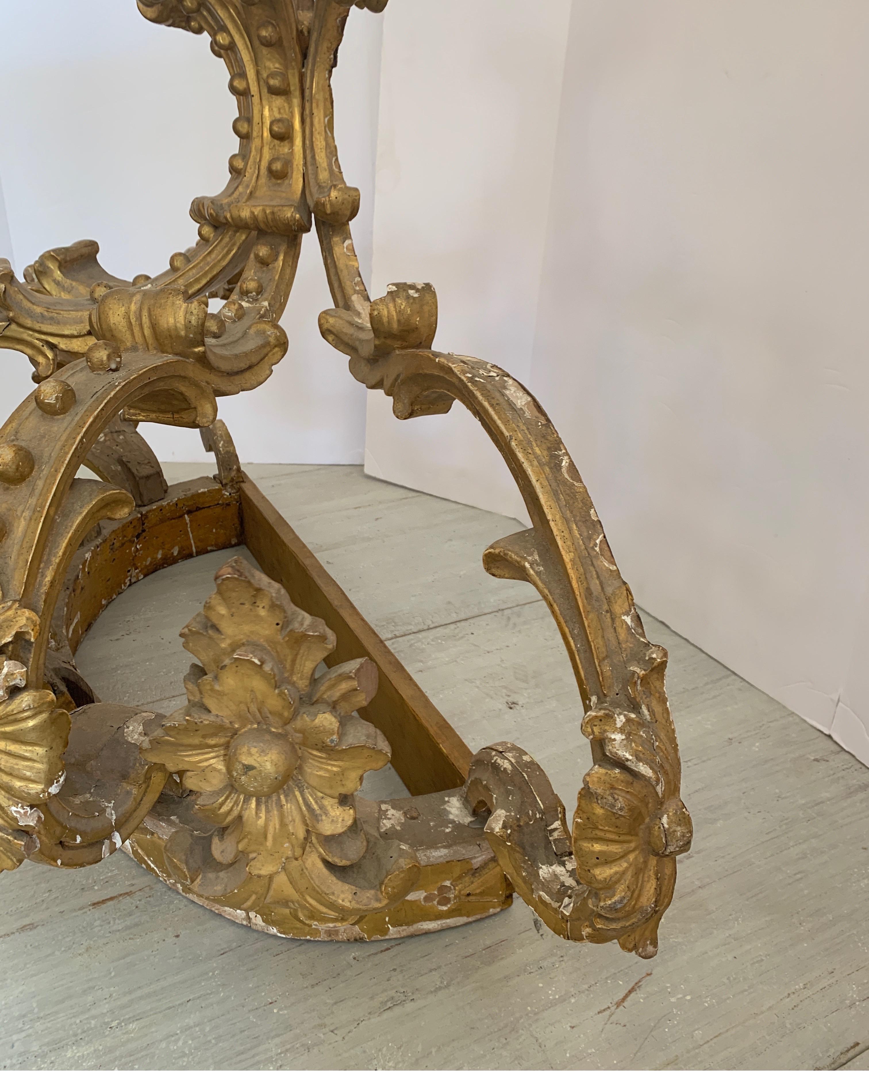 This is a wonderful gilt wooden crown from Italy. It would be perfect attached to a wall above a bed or in a private chapel.