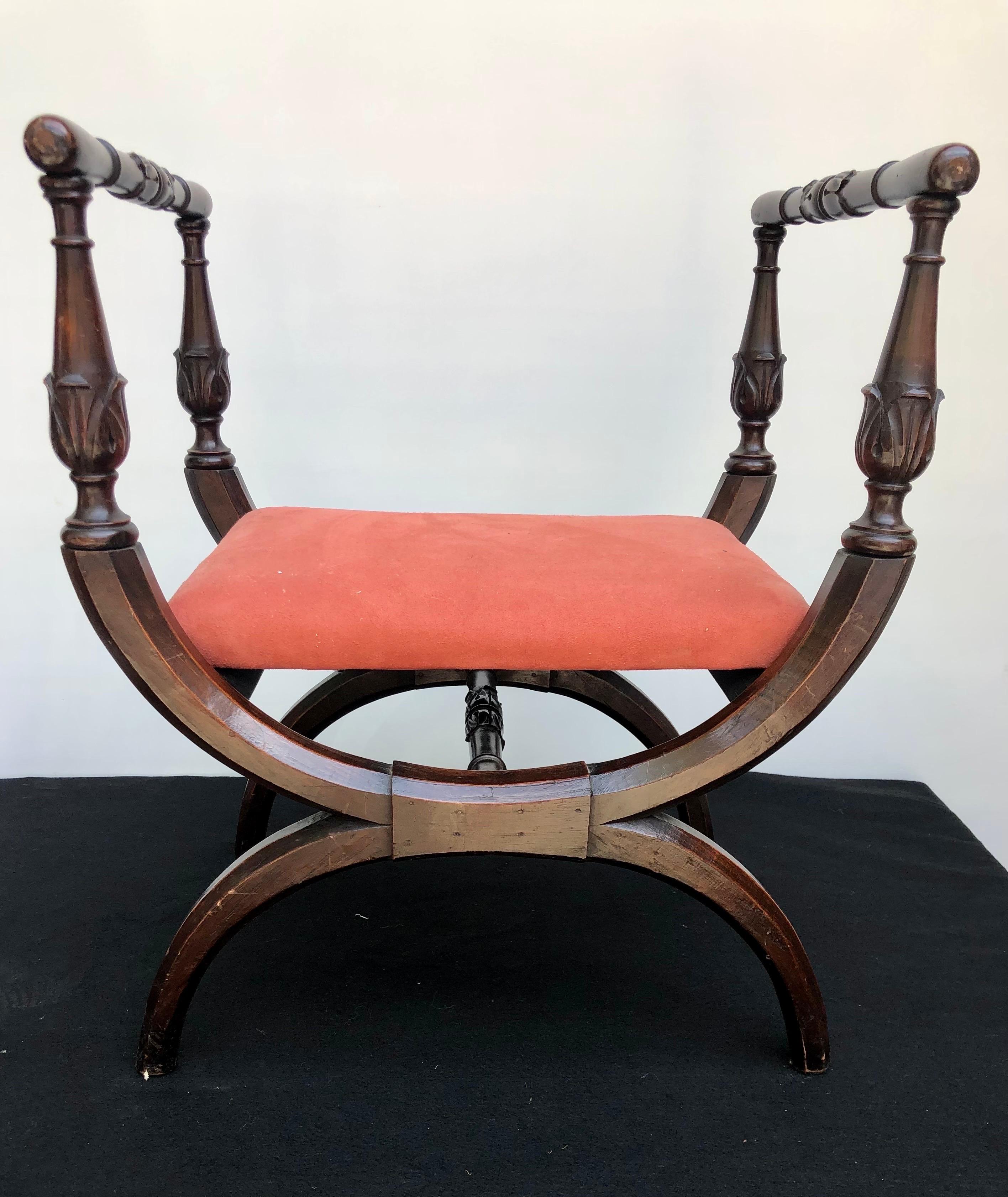 Elegant Neoclassical Italian bench, circa 1815, with a curulean frame and coral suede upholstery was made in the early 19th Century. A related example can be found on page 315 in 